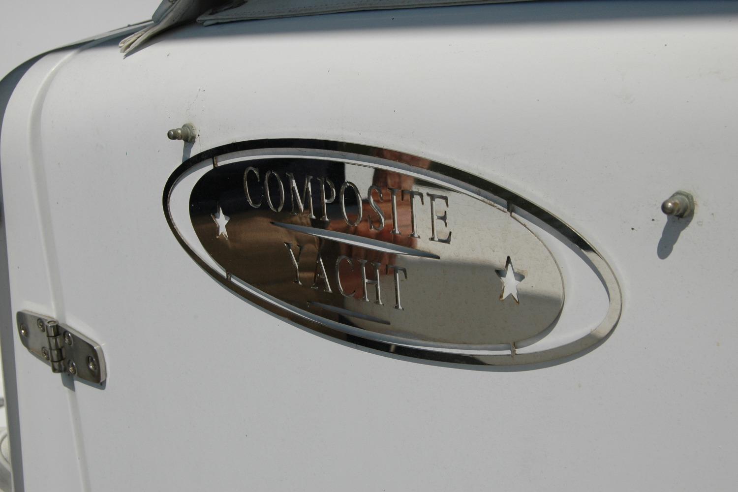 Composite Yacht 26 emblem on white surface, 2013 model.