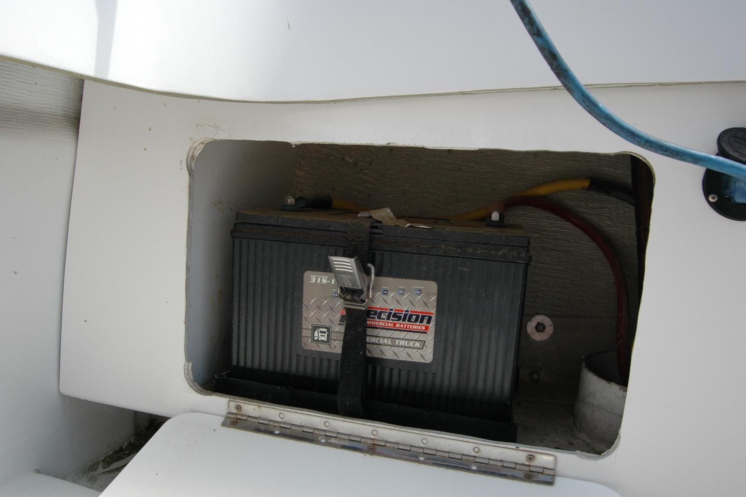 Battery compartment of 2013 Composite Yacht 26 with visible wiring.