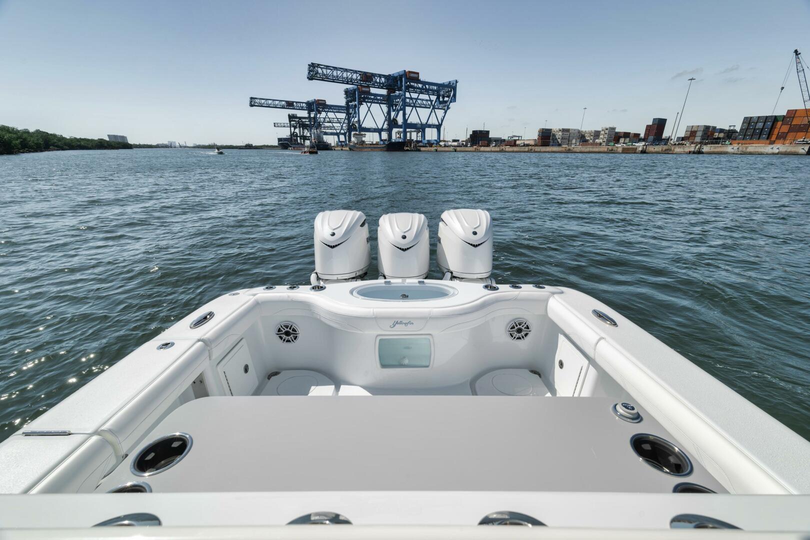 Yellowfin-36 Offshore 2025-36 Offshore FL-US-2025 Yellowfin 36 Offshore boat with triple engines, dockside view, industrial background.-9817861 | Thumbnail