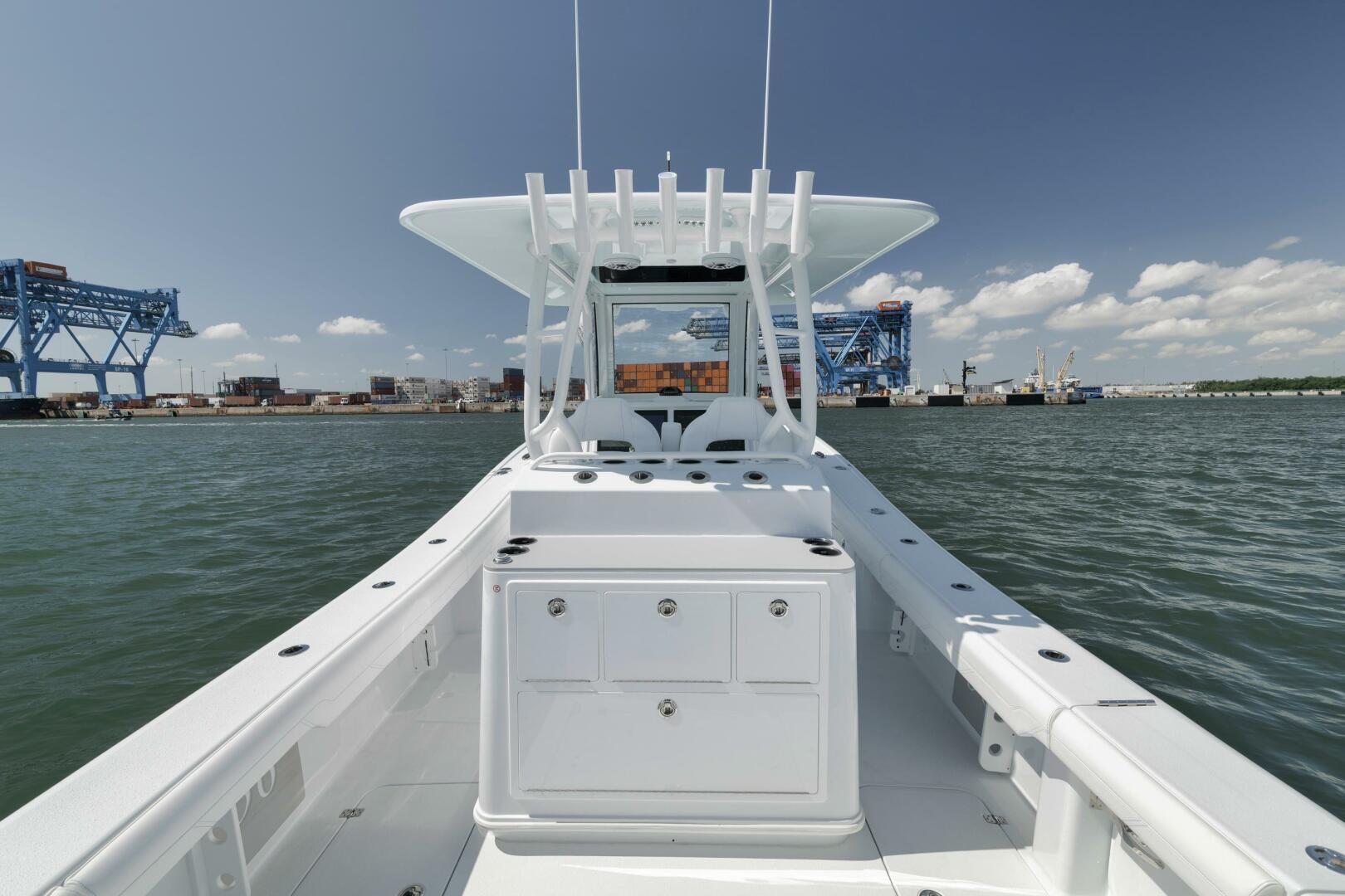 Yellowfin-36 Offshore 2025-36 Offshore FL-US-2025 Yellowfin 36 Offshore boat on water, with industrial background and clear sky.-9817861 | Thumbnail