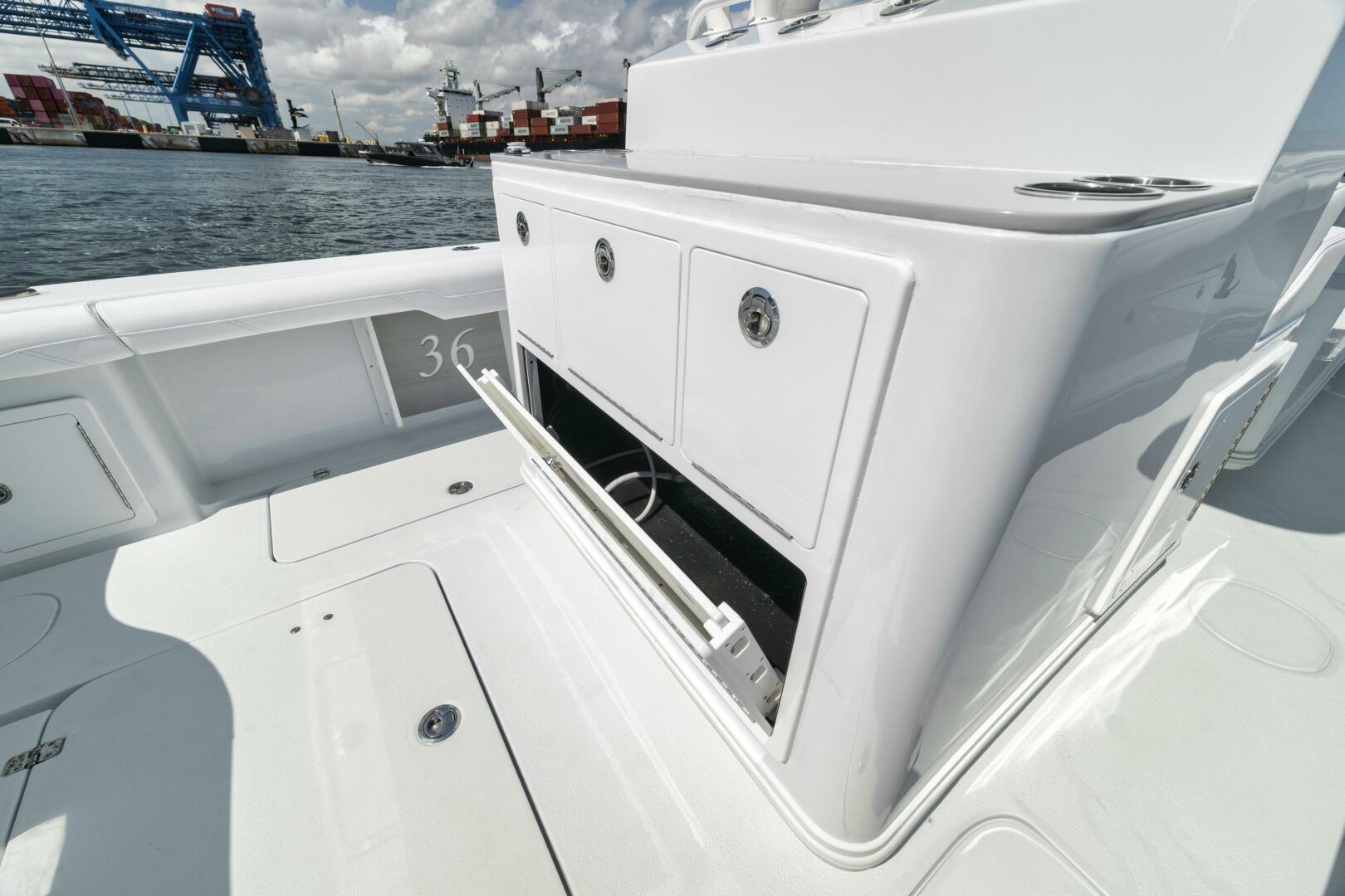Yellowfin-36 Offshore 2025-36 Offshore FL-US-2025 Yellowfin 36 Offshore boat interior with storage compartments, dockside view.-9817861 | Thumbnail