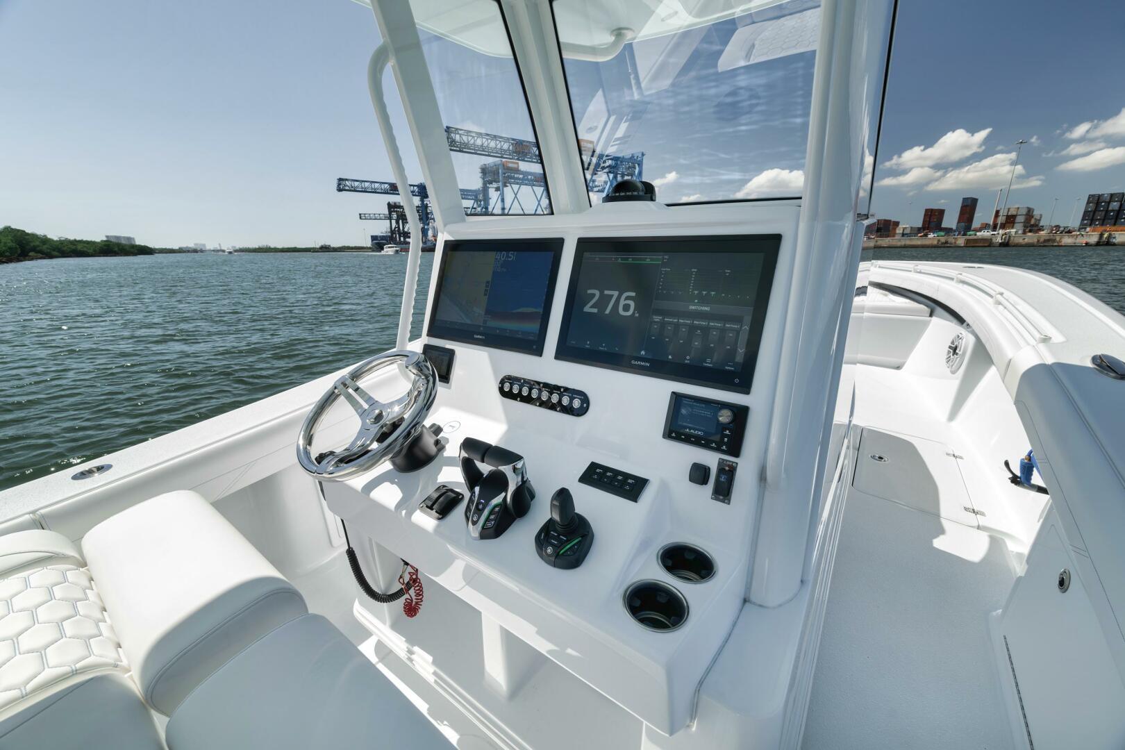 Yellowfin-36 Offshore 2025-36 Offshore FL-US-2025 Yellowfin 36 Offshore boat dashboard with modern navigation equipment on open water.-9817861 | Thumbnail