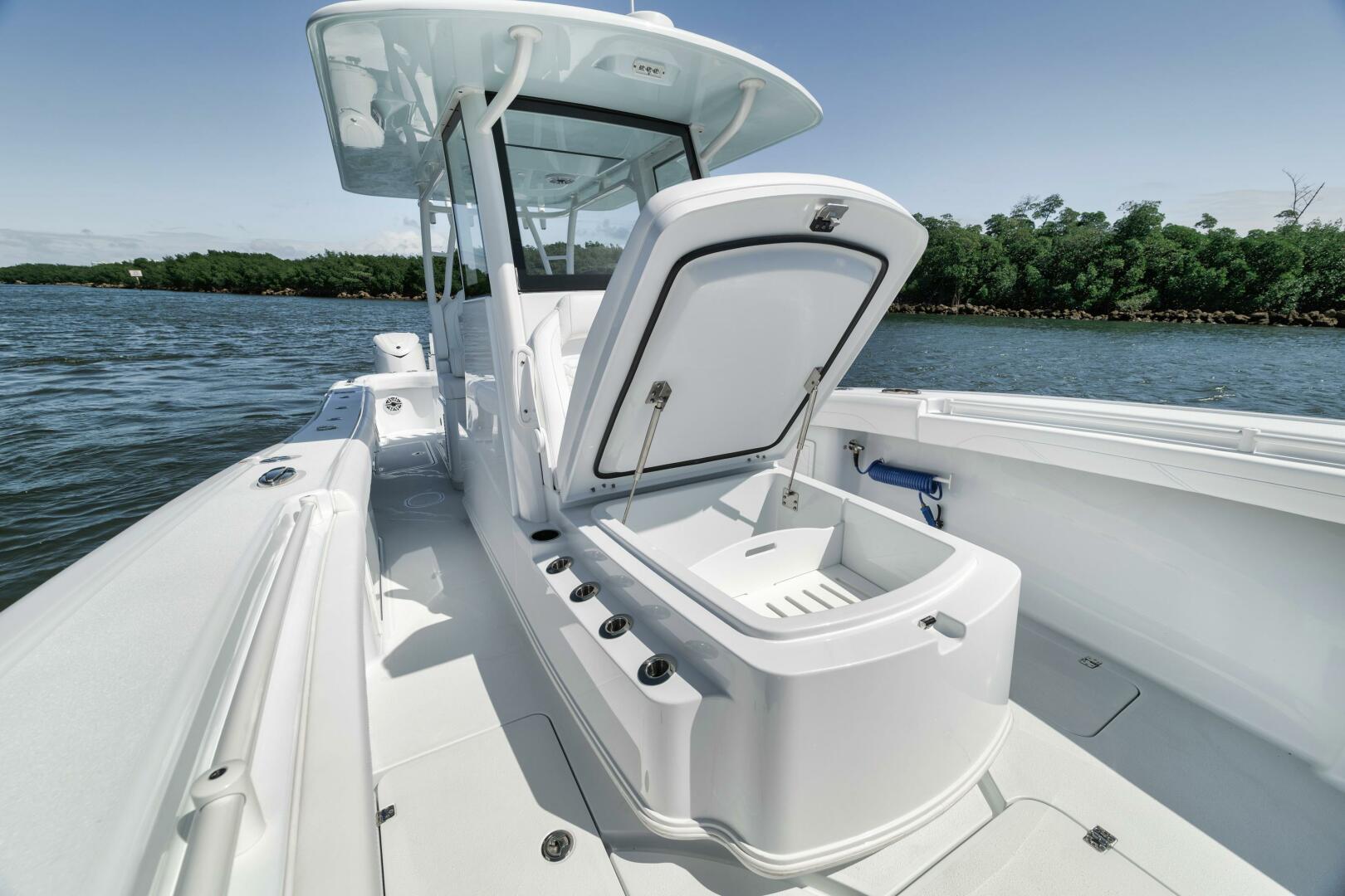 Yellowfin-36 Offshore 2025-36 Offshore FL-US-2025 Yellowfin 36 Offshore boat with open storage compartment on calm water.-9817861 | Thumbnail
