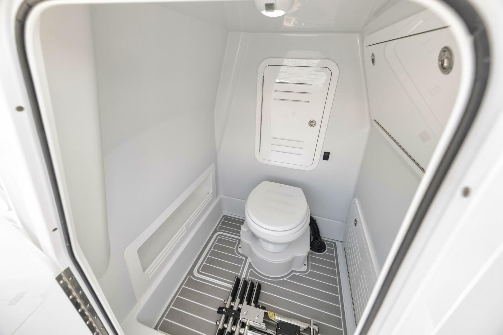Yellowfin-36 Offshore 2025-36 Offshore FL-US-2025 Yellowfin 36 Offshore boat interior bathroom with toilet and storage compartments.-9817861 | Thumbnail