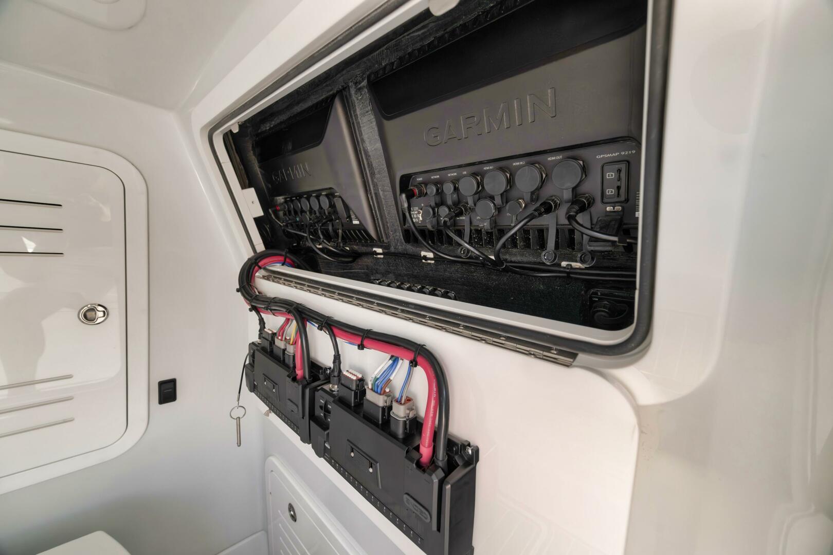 Yellowfin-36 Offshore 2025-36 Offshore FL-US-Electrical panel inside 2025 Yellowfin 36 Offshore boat, featuring Garmin equipment and wiring.-9817861 | Thumbnail