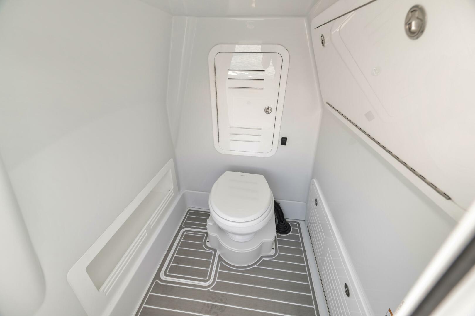Yellowfin-36 Offshore 2025-36 Offshore FL-US-2025 Yellowfin 36 Offshore boat interior bathroom with modern design and compact toilet.-9817861 | Thumbnail