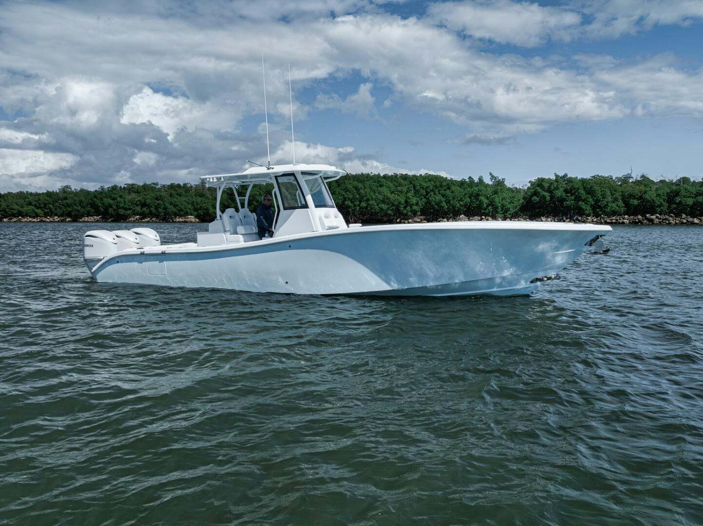 Yellowfin-36 Offshore 2025-36 Offshore FL-US-2025 Yellowfin 36 Offshore boat on water, clear sky, lush greenery in background.-9817861 | Thumbnail