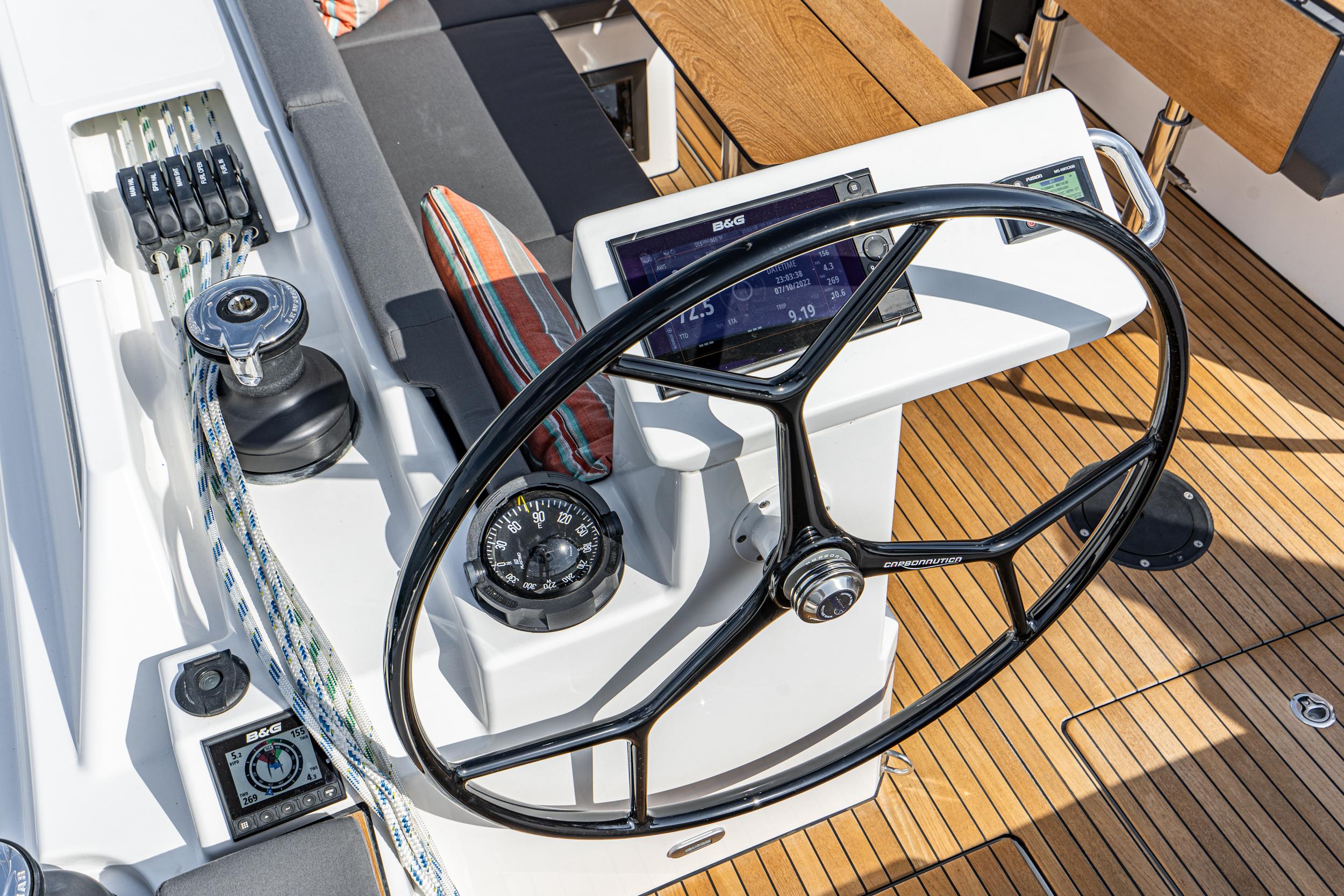 Bavaria-C45 2024-In stock and availabe now CA-US-2024 Bavaria C45 yacht helm with steering wheel, compass, and navigation controls on teak deck.-9712200 | Thumbnail