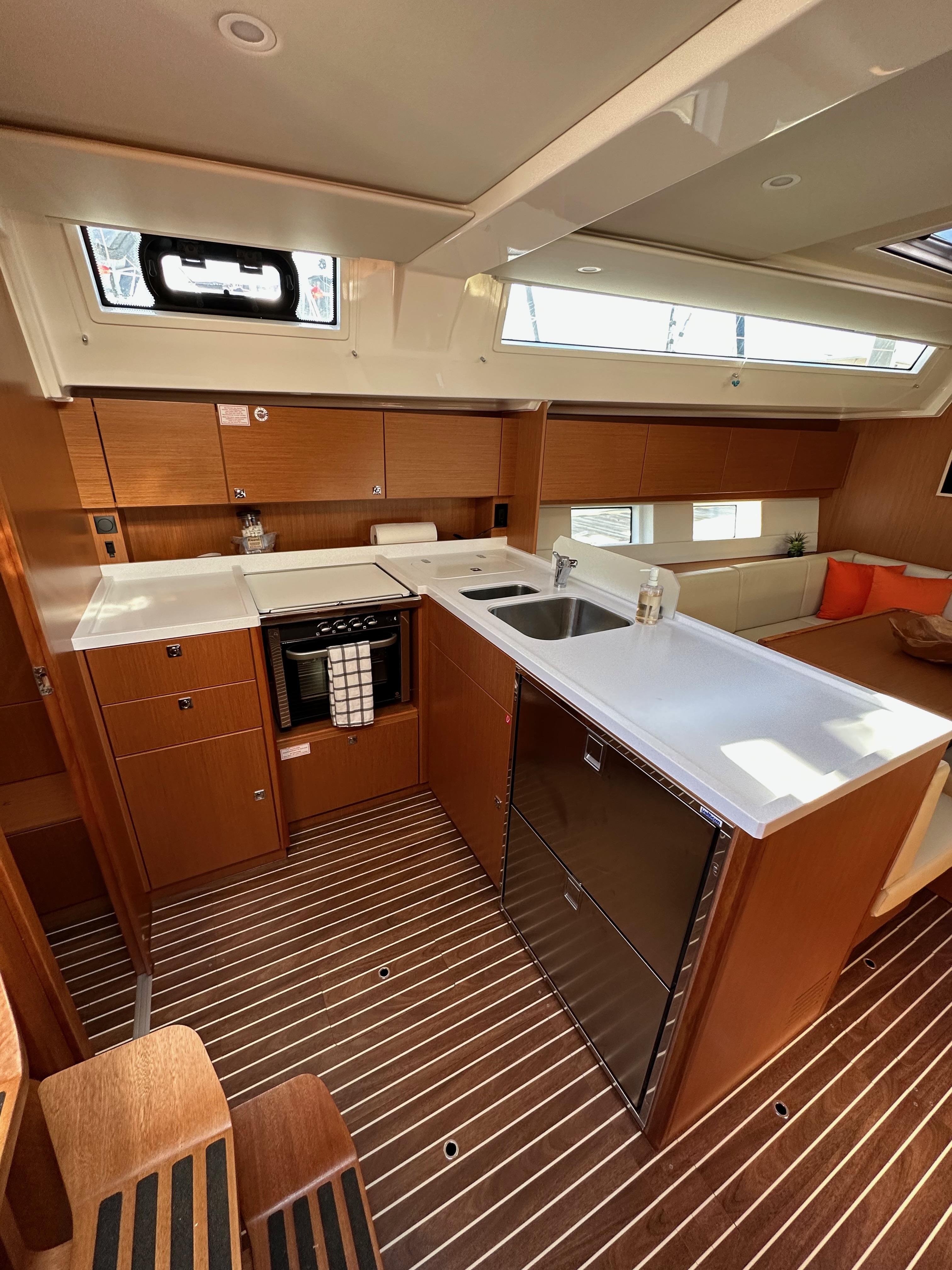 Bavaria-C45 2024-In stock and availabe now CA-US-2024 Bavaria C45 yacht interior with modern kitchen and sleek wooden finishes.-9712200 | Thumbnail