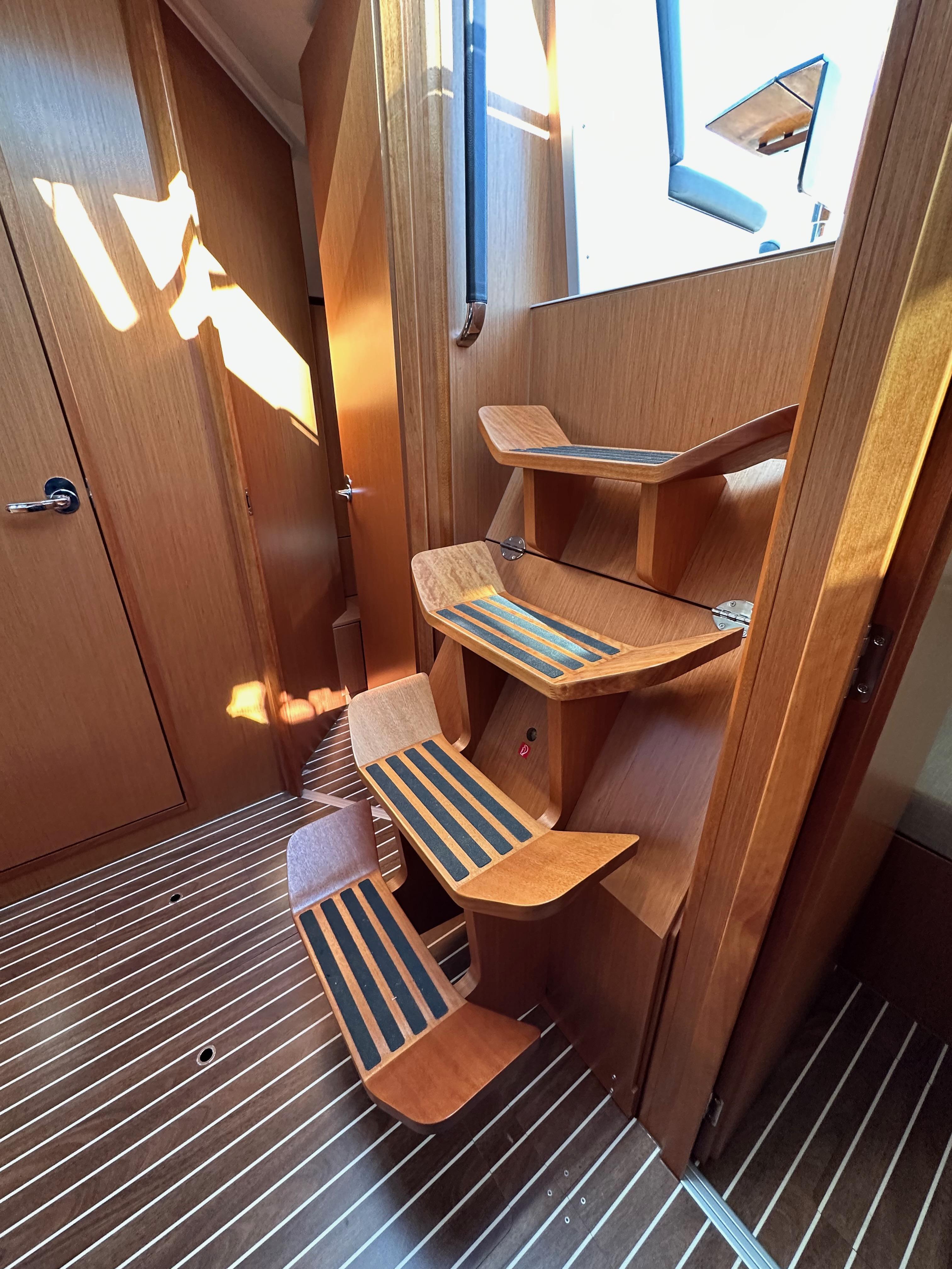 Bavaria-C45 2024-In stock and availabe now CA-US-Interior of 2024 Bavaria C45 yacht with wooden stairs and striped flooring.-9712200 | Thumbnail