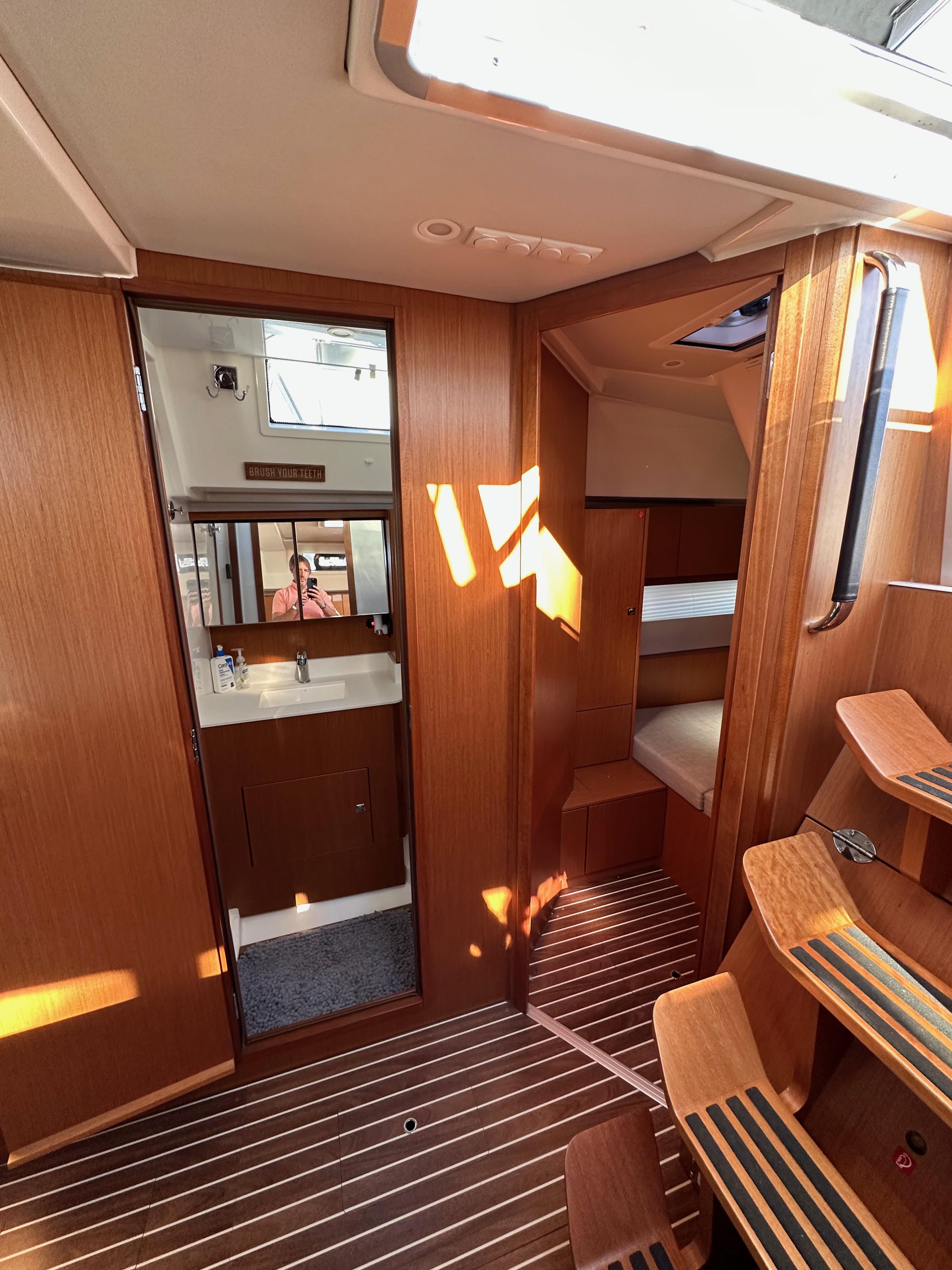 Bavaria-C45 2024-In stock and availabe now CA-US-2024 Bavaria C45 yacht interior with wooden finish, showing cabin and bathroom.-9712200 | Thumbnail