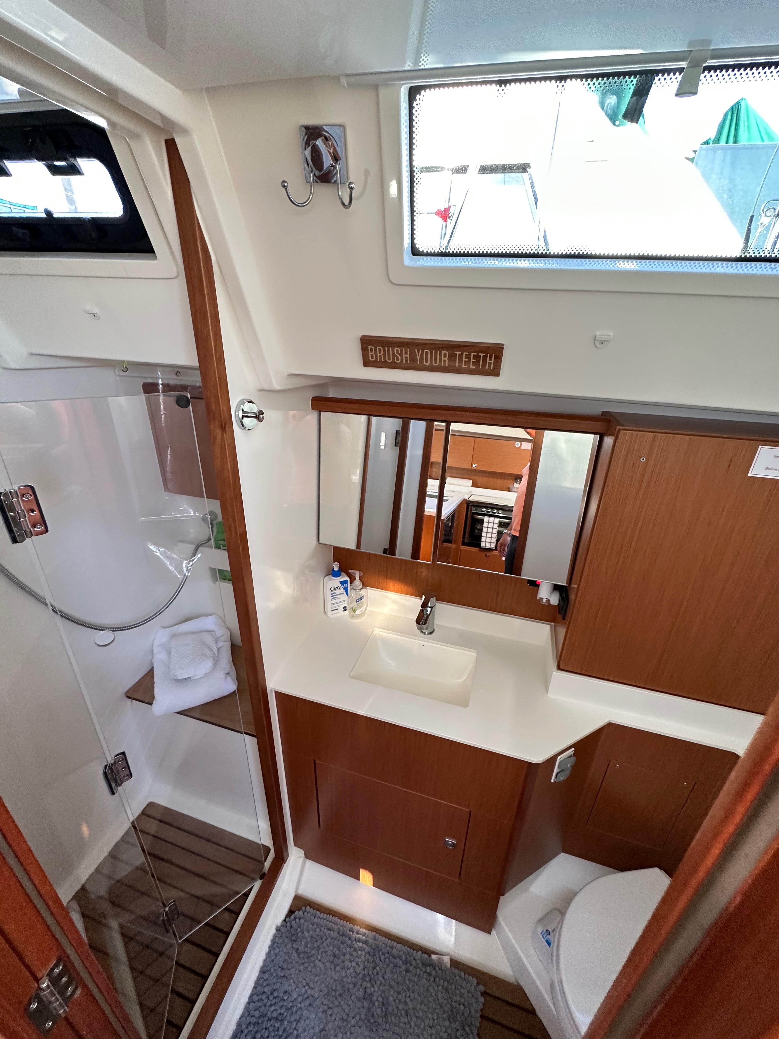 Bavaria-C45 2024-In stock and availabe now CA-US-2024 Bavaria C45 yacht bathroom with modern fixtures and wooden accents.-9712200 | Thumbnail
