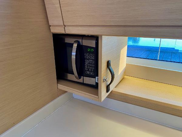 Microwave in Jeanneau 54 yacht's wooden cabinet, 2016 model.