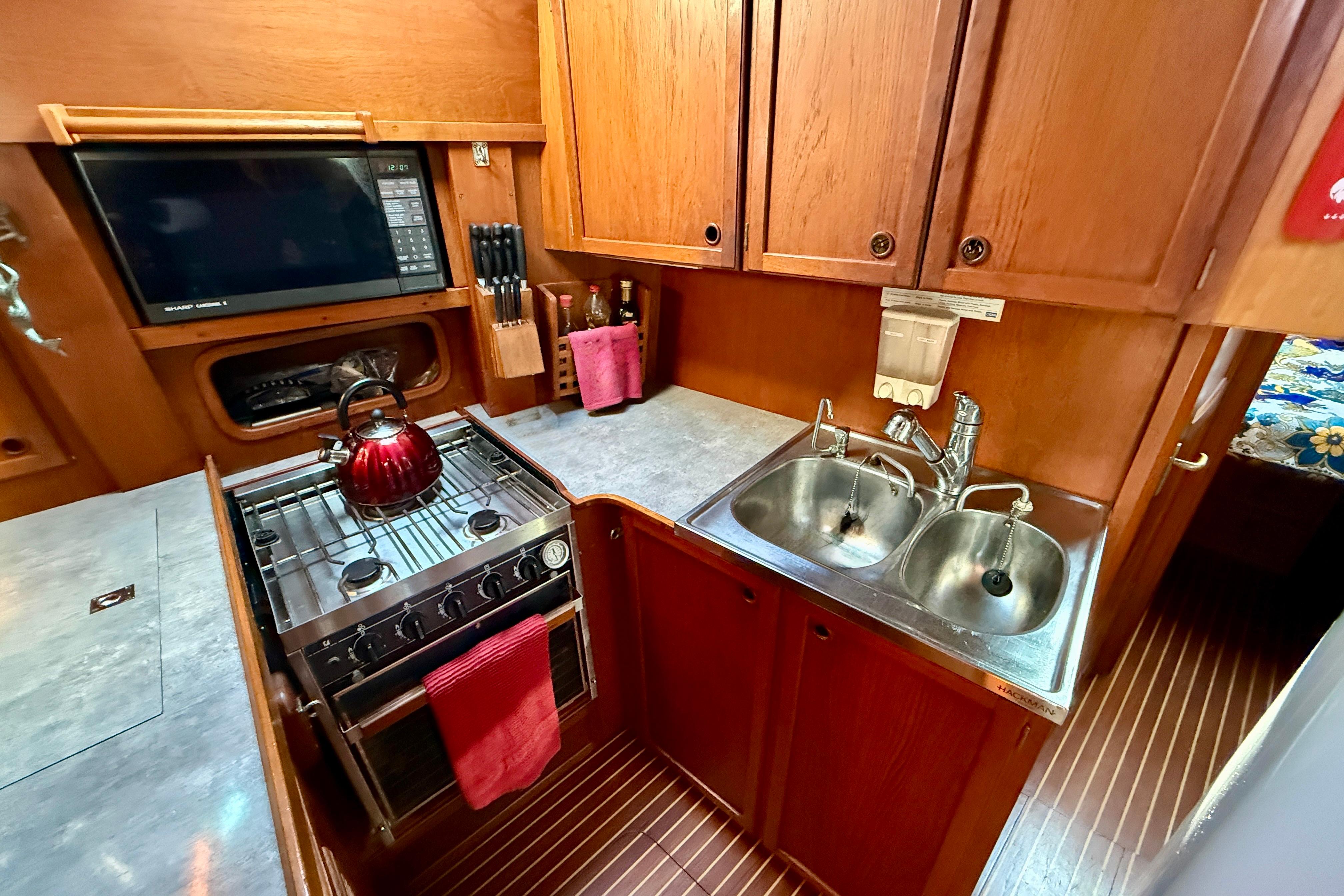 Propane range with oven, great counter space, under deck refrigeration and double stainless steel sinks