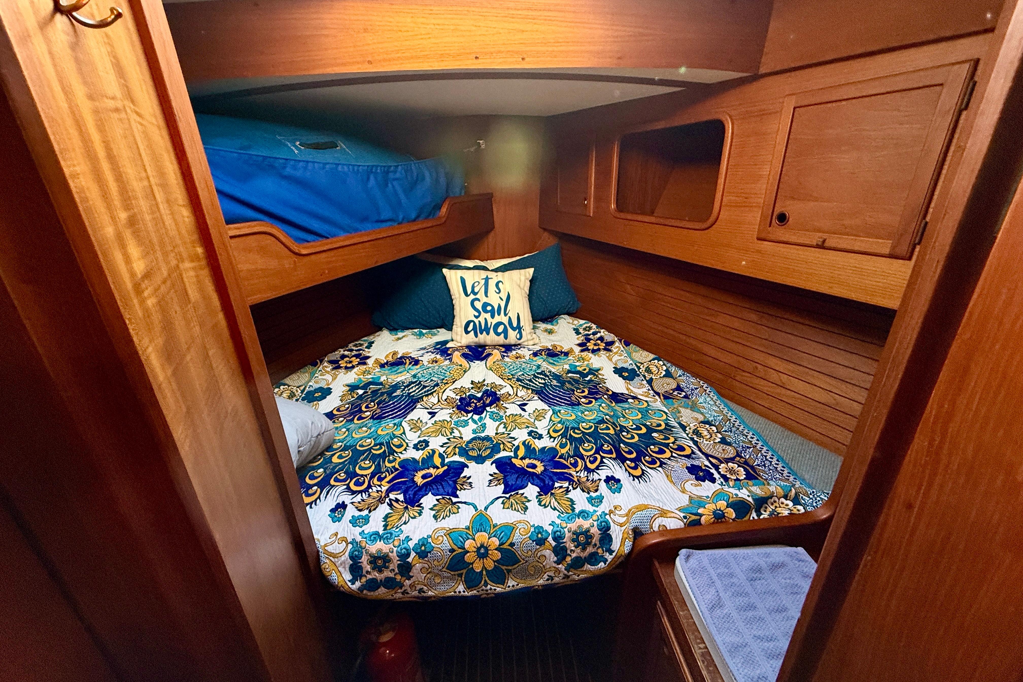 V-Berth stateroom forward with single berth above to port