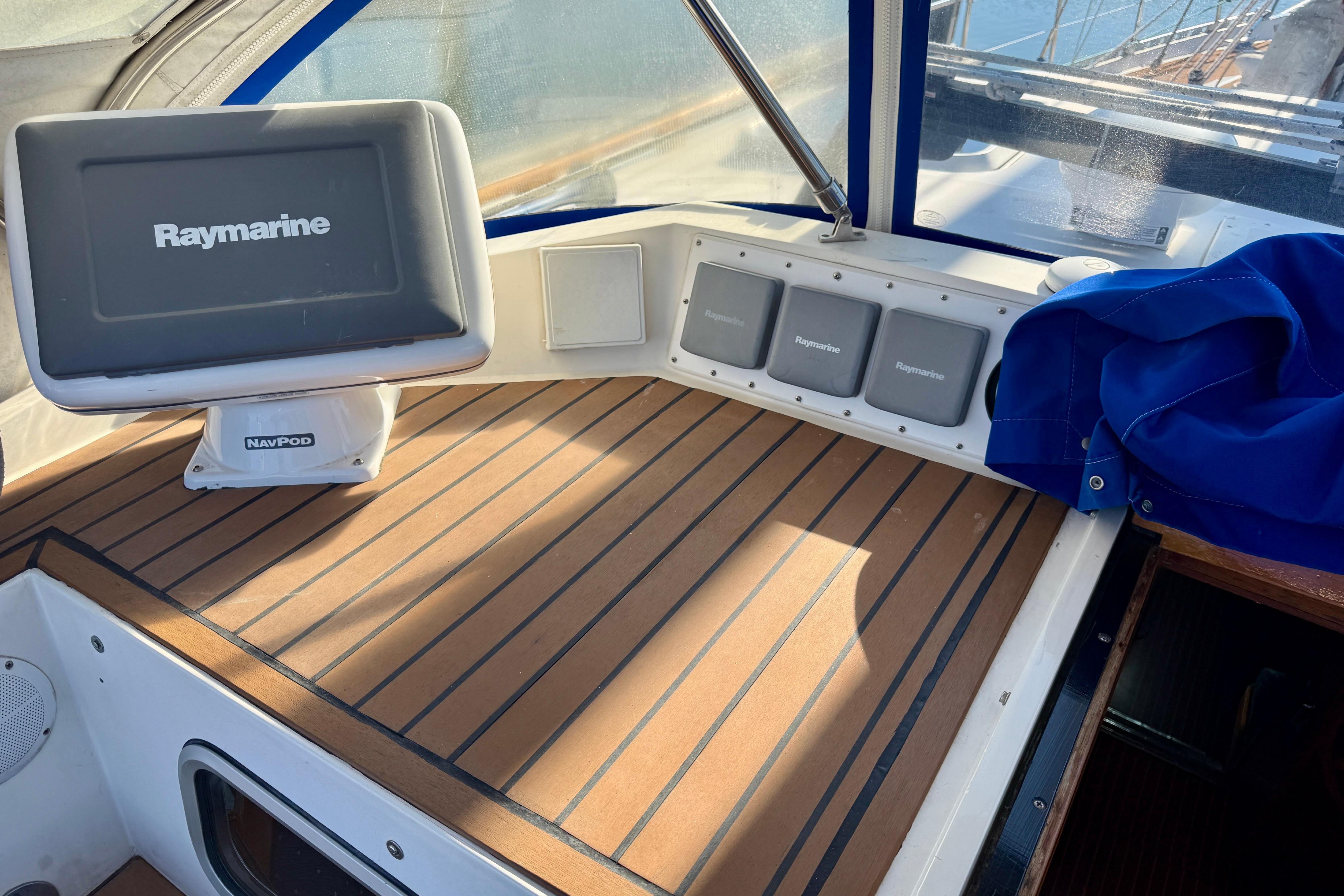 Cockpit of 1986 Nauticat 43 with Raymarine navigation equipment and FlexiTeak composite decking.