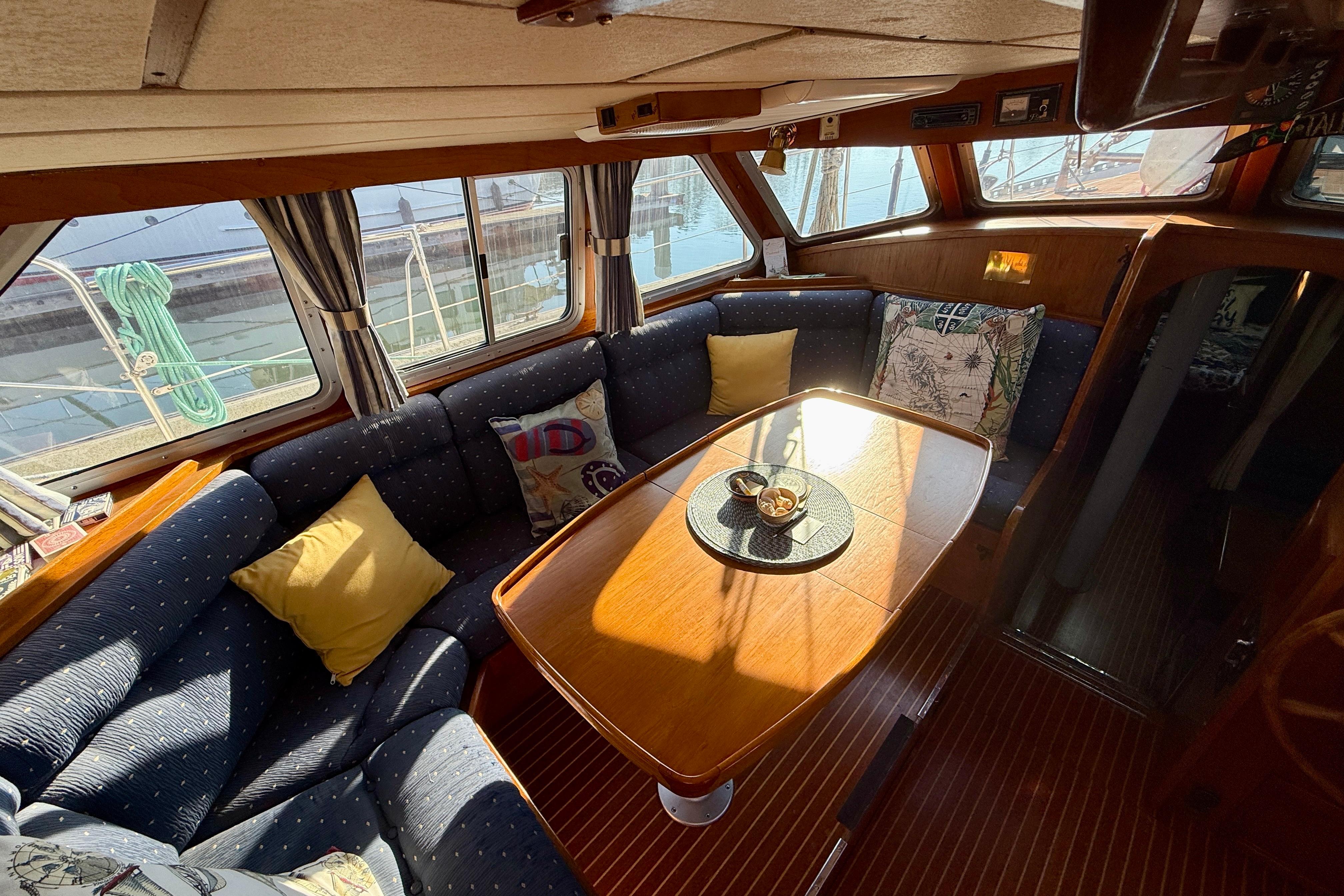 Comfortable dinette in pilothouse with great visibility.