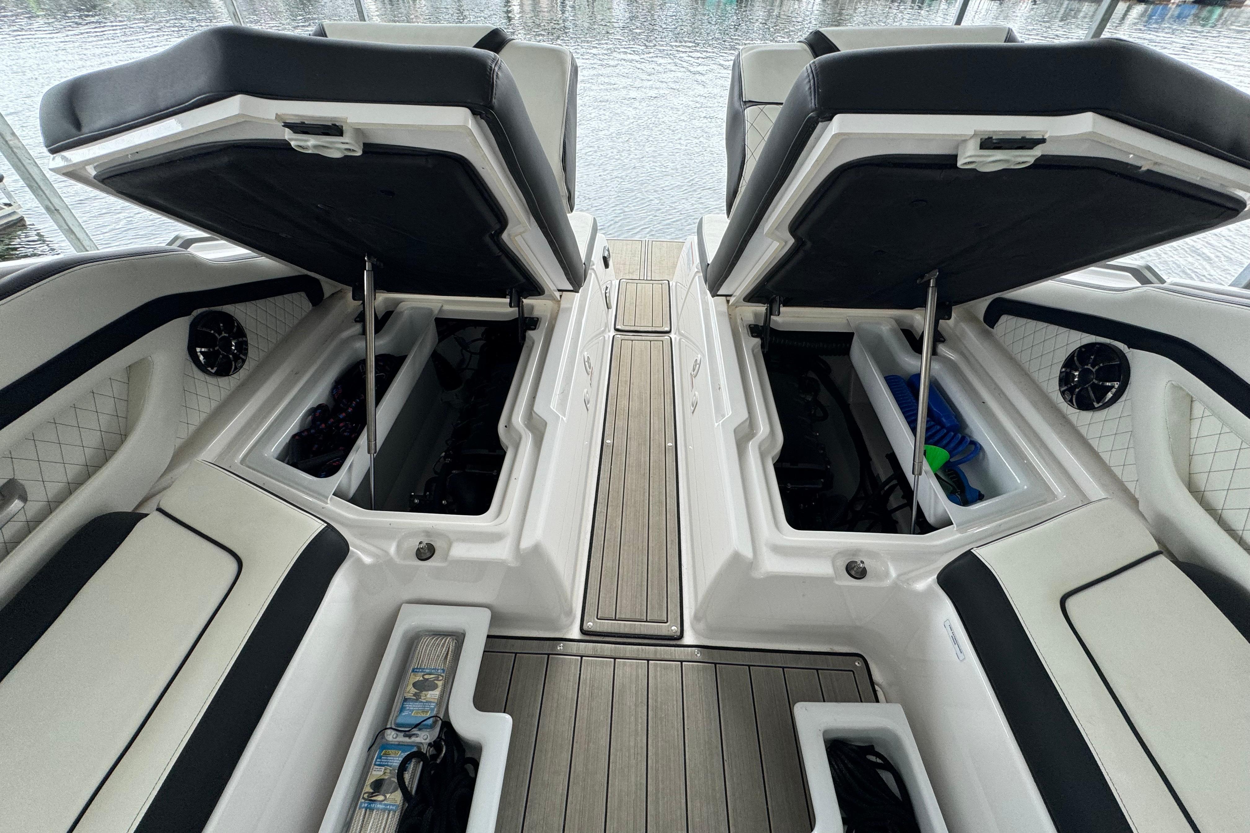 2024 Yamaha Boats 275SD interior storage compartments open, showcasing spacious design and functionality.