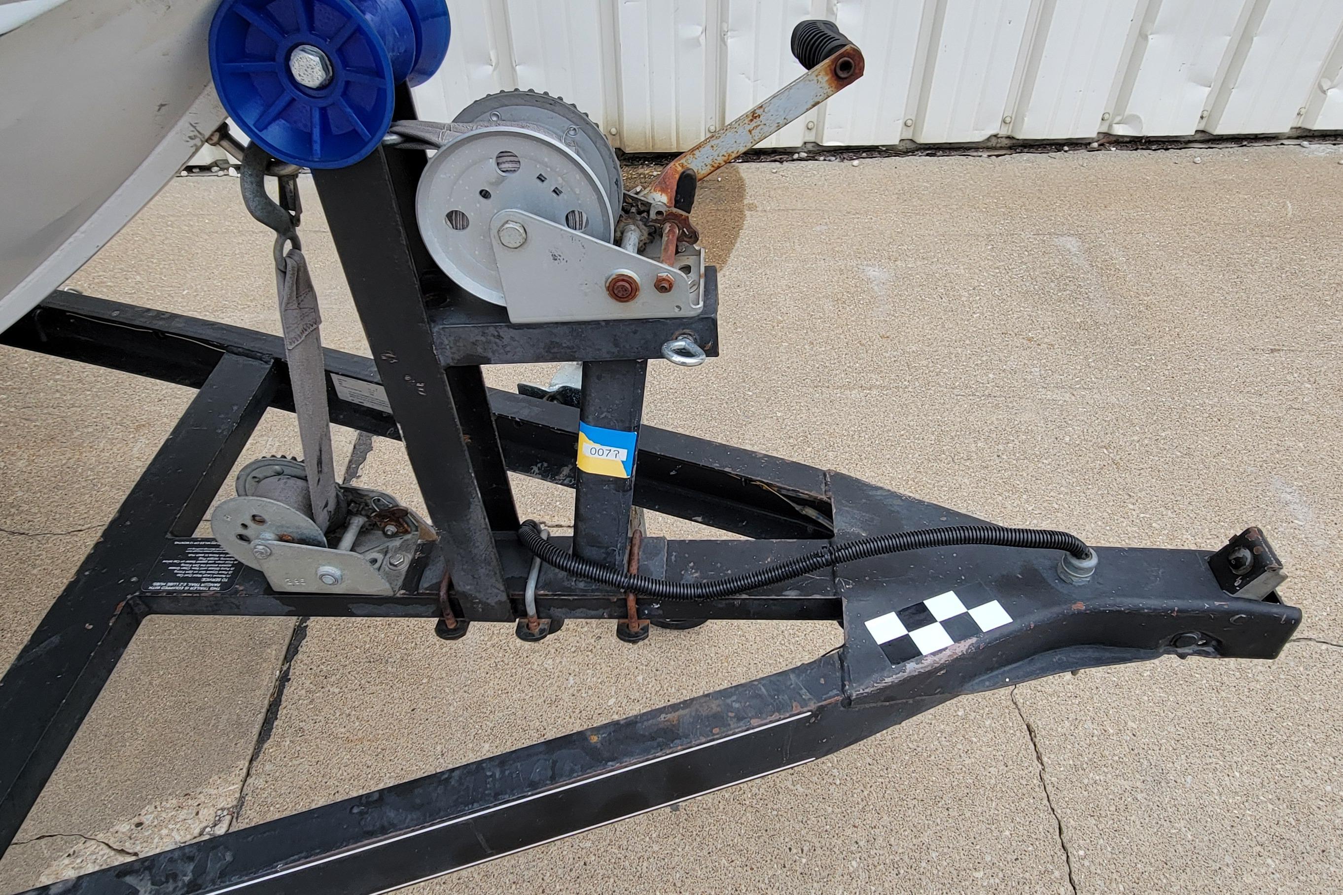 Trailer hitch and winch system on a 1999 Ranger 107 Cherokee boat trailer.