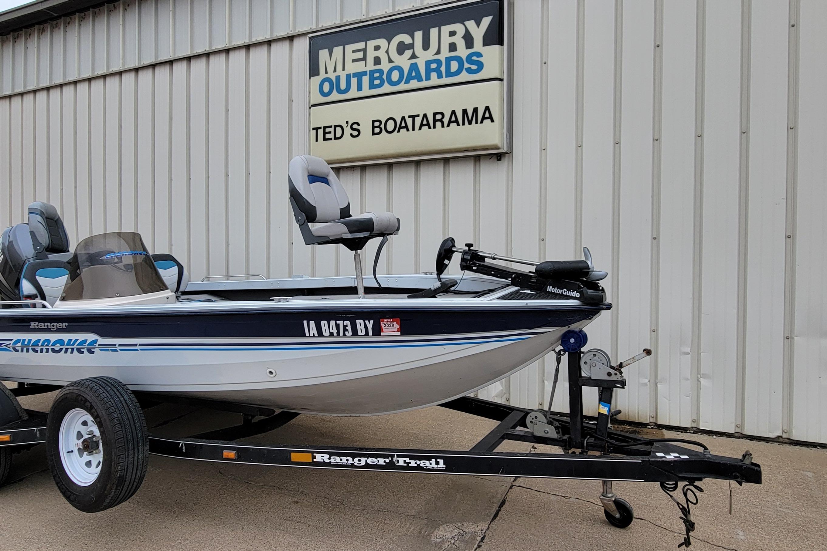 1999 Ranger 107 Cherokee boat on trailer at Ted's Boatarama, Mercury Outboards sign visible.