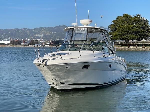 2005 Sea Ray Amberjack 290 boat on calm water, scenic background.