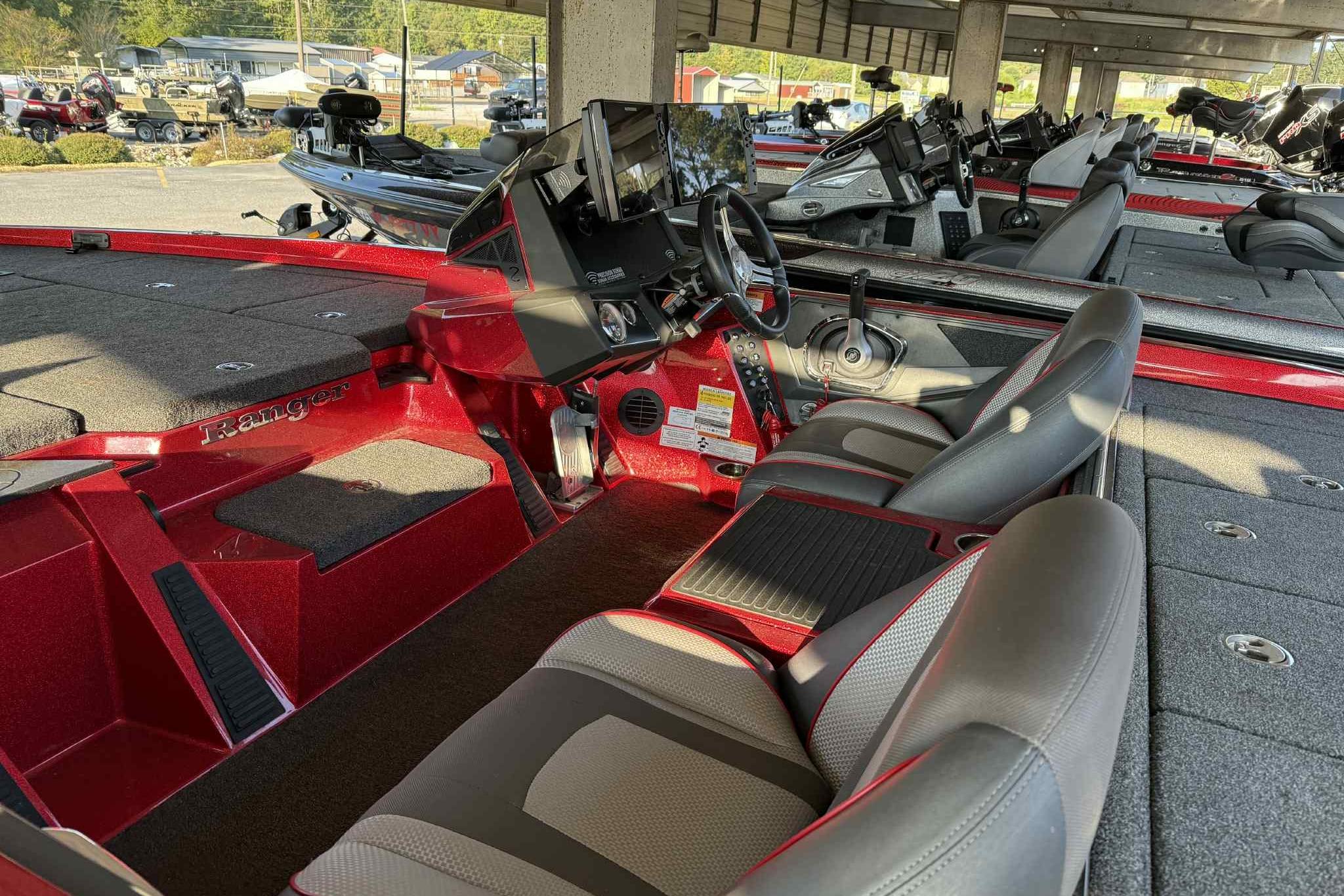 2024 Ranger Z518 boat interior with red accents and modern dashboard.