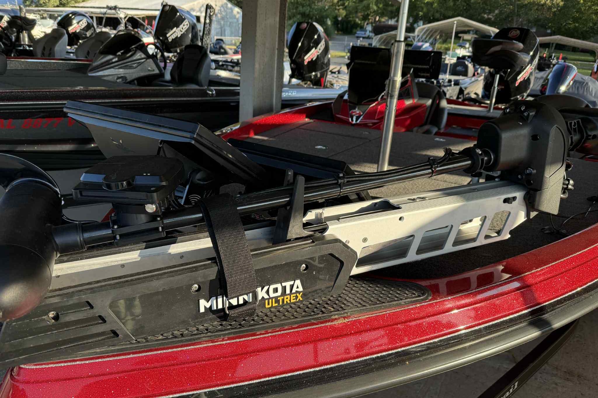 2024 Ranger Z518 boat with Minn Kota Ultrex trolling motor, docked in a marina.