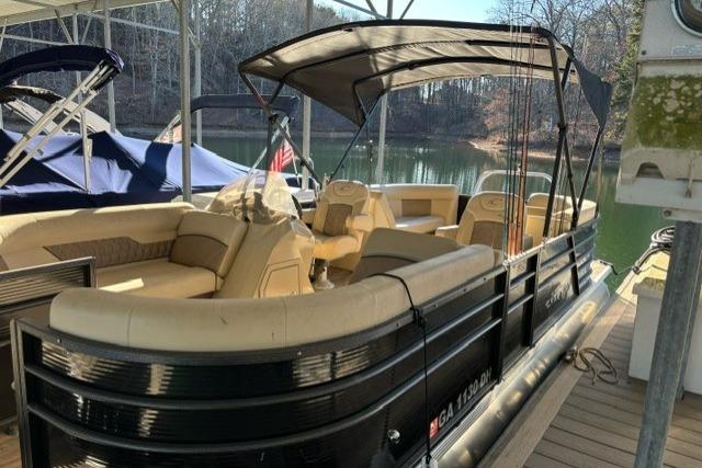 2019 Crest 220 CREST II pontoon boat docked on a serene lake.