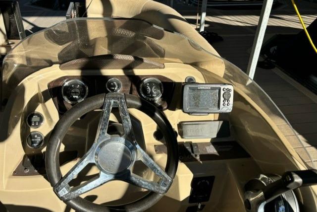 Steering console of 2019 Crest 220 CREST II boat with gauges and navigation system.