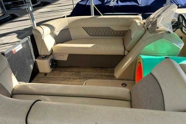 2019 Crest 220 CREST II boat interior with beige seating and wood flooring.