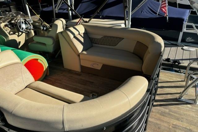 2019 Crest 220 CREST II pontoon boat with beige seating and wooden deck.