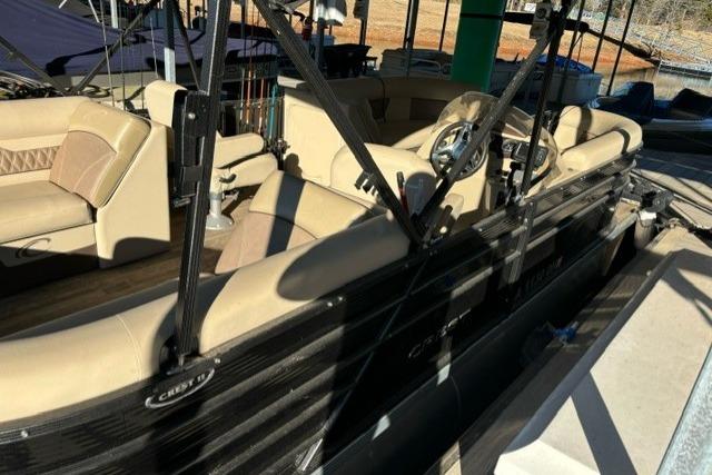 2019 Crest 220 CREST II pontoon boat with beige seating and black exterior.