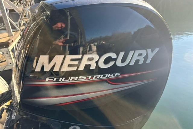 Mercury FourStroke engine on 2019 Crest 220 CREST II boat, reflecting sunlight.