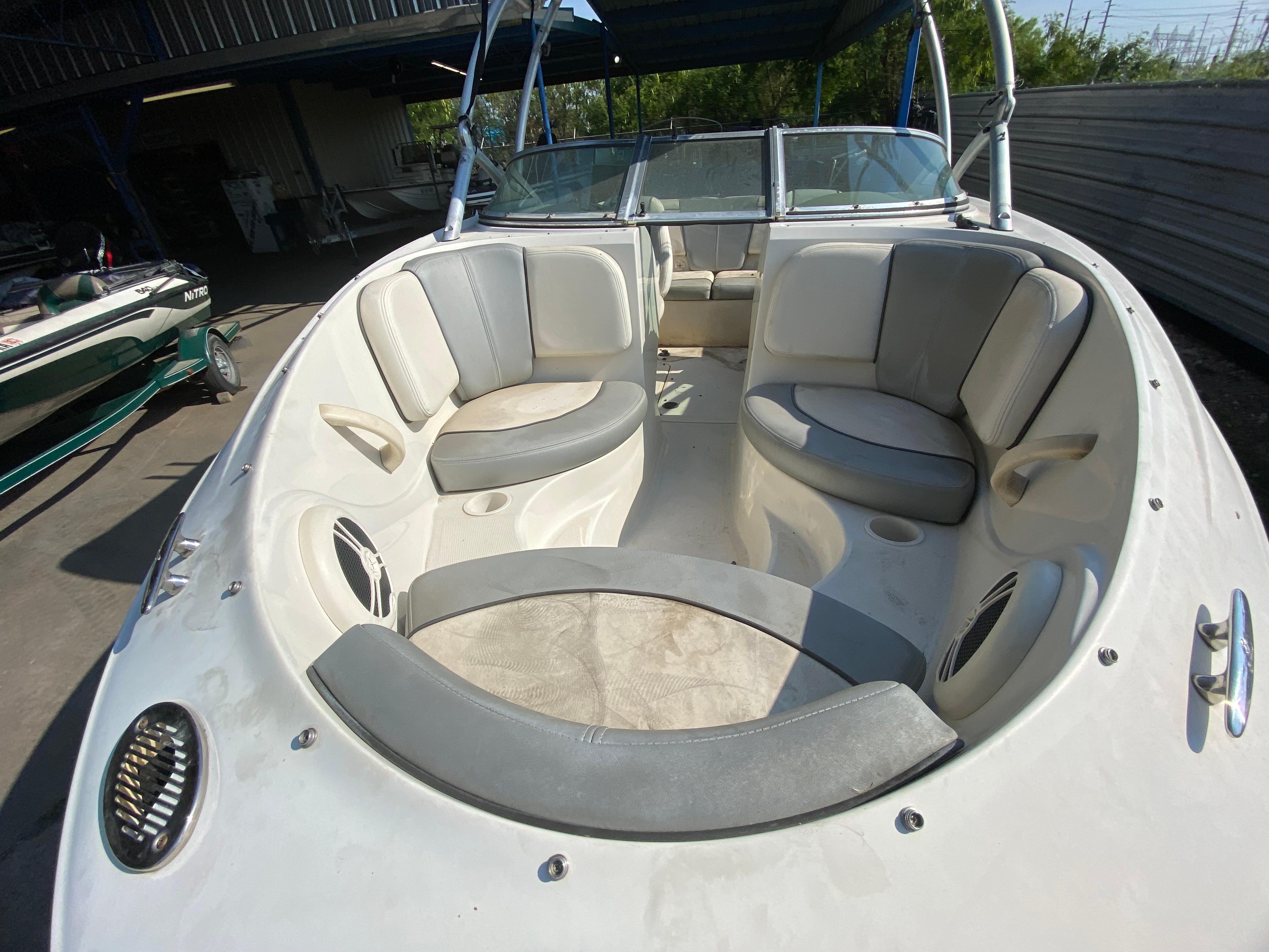 2008 Sea Ray 185 Sport boat interior with cushioned seating and open bow design.