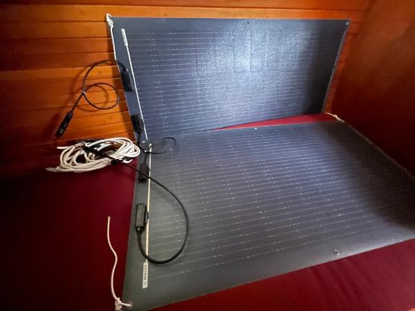 Flexible solar panels inside a 1980 Davidson 44 boat cabin, with visible wiring.