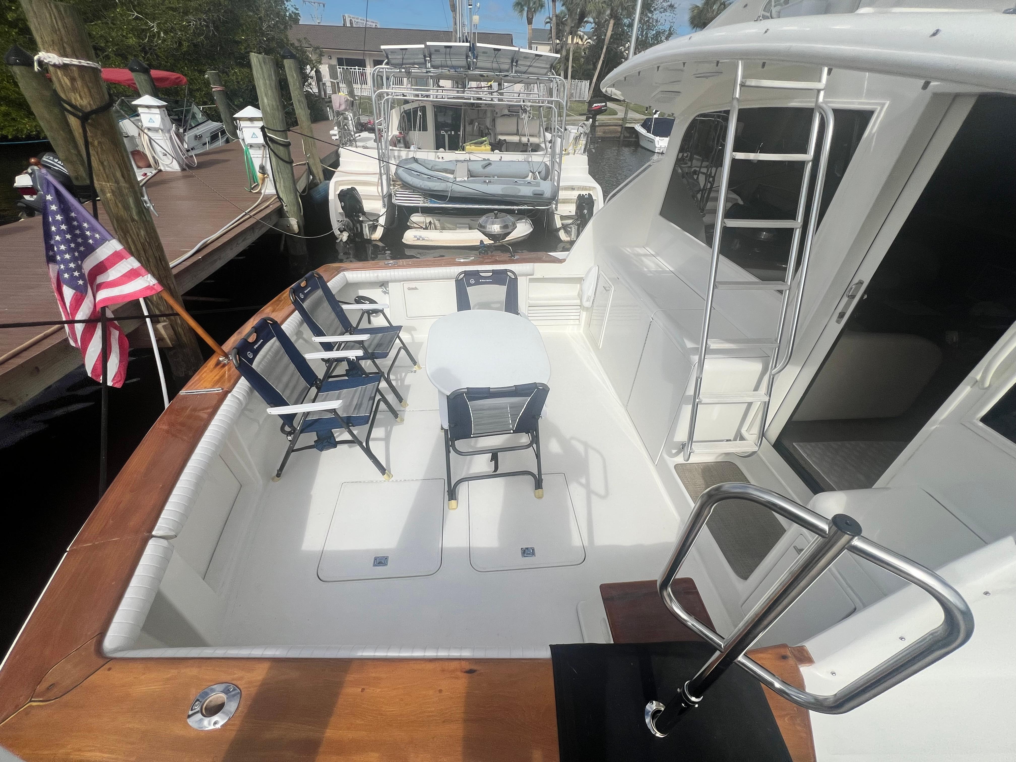 Ocean Yachts-48 Super Sport 1996-Fender Bender FL-US-1996 Ocean Yachts 48 Super Sport deck with seating and American flag.-9657986 | Thumbnail