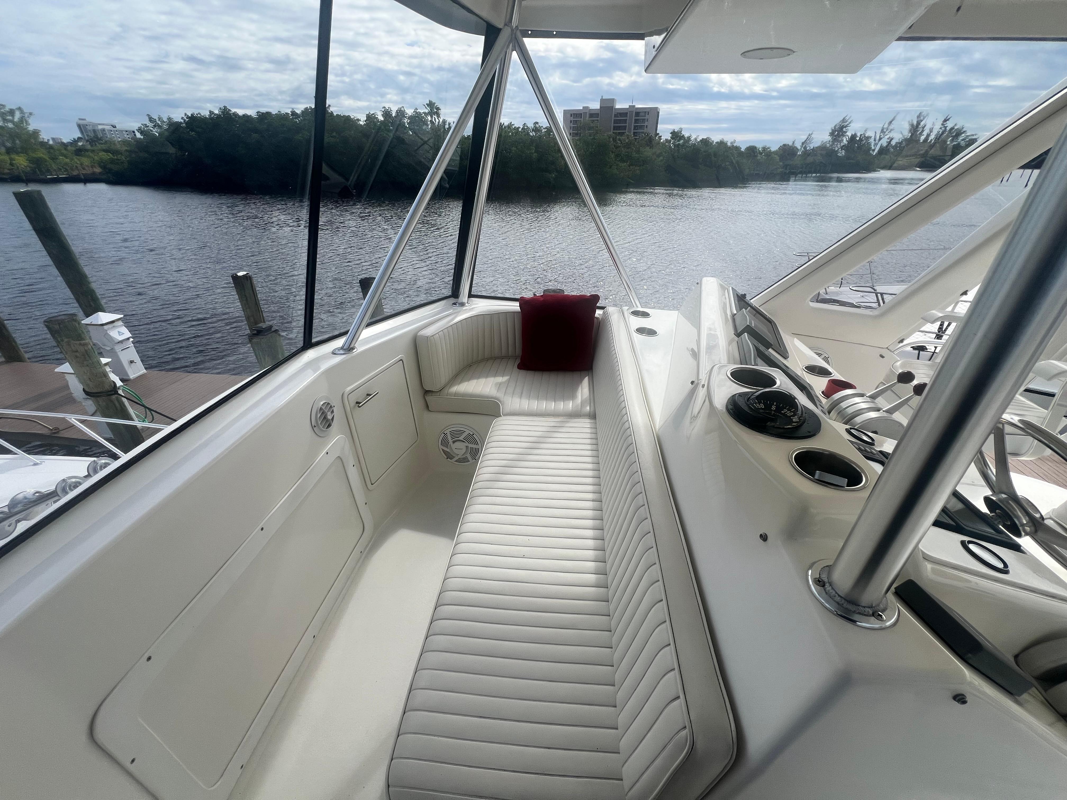 Ocean Yachts-48 Super Sport 1996-Fender Bender FL-US-1996 Ocean Yachts 48 Super Sport boat interior with white seating and river view.-9657986 | Thumbnail