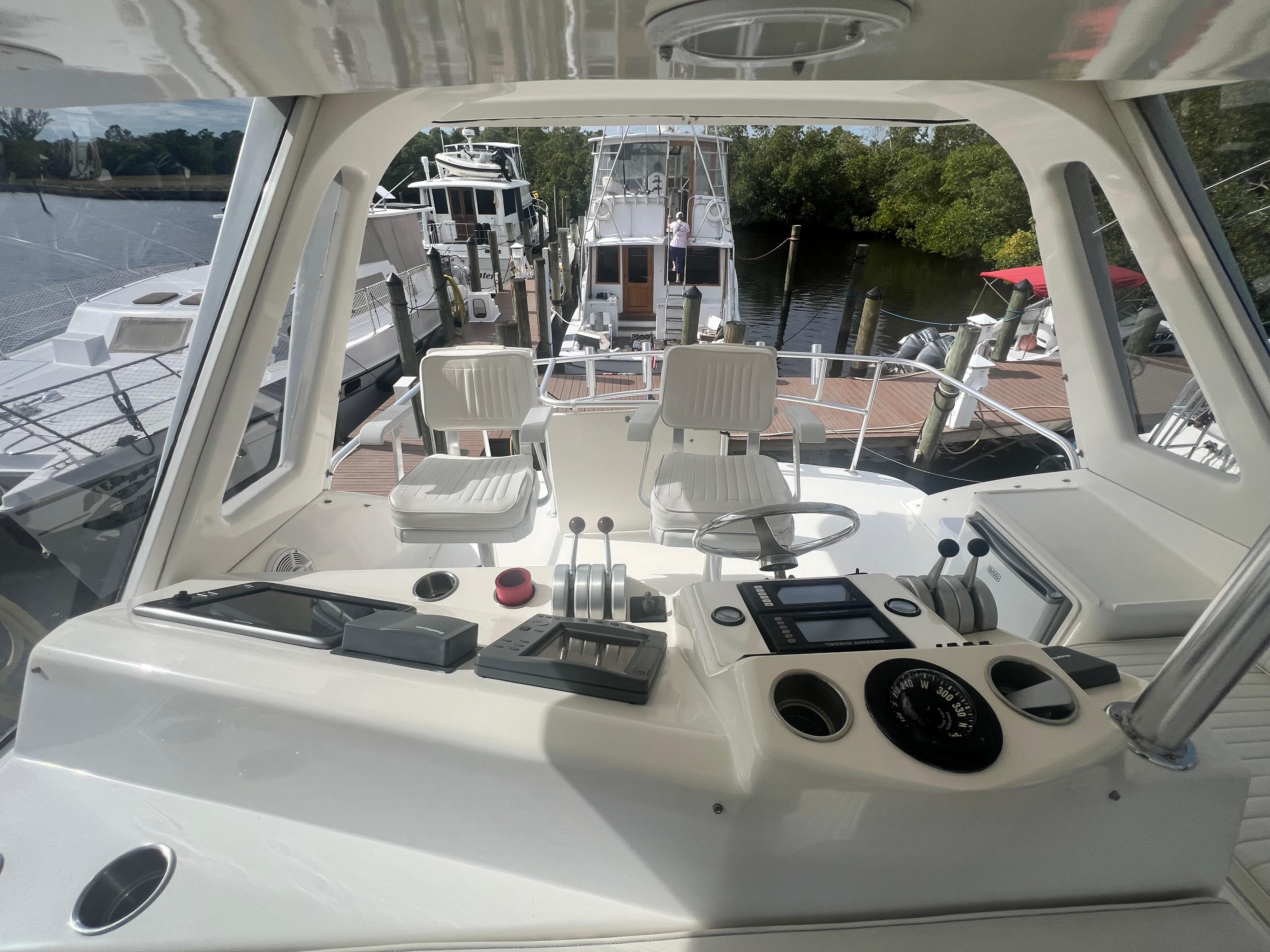 Ocean Yachts-48 Super Sport 1996-Fender Bender FL-US-1996 Ocean Yachts 48 Super Sport cockpit with steering wheel and control panel.-9657986 | Thumbnail