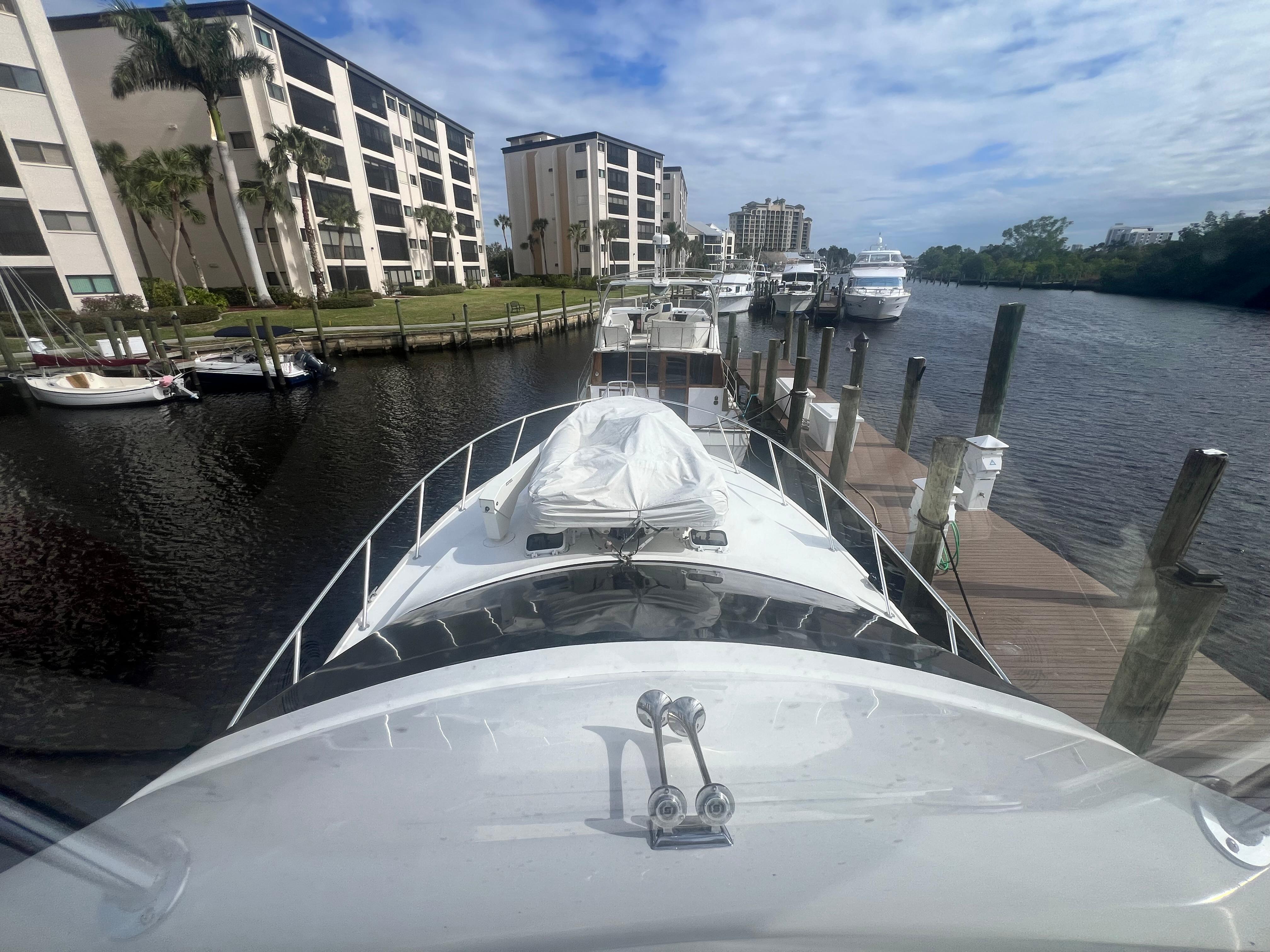 Ocean Yachts-48 Super Sport 1996-Fender Bender FL-US-Ocean Yachts 1996 model 48 Super Sport docked at marina with waterfront buildings.-9657986 | Thumbnail