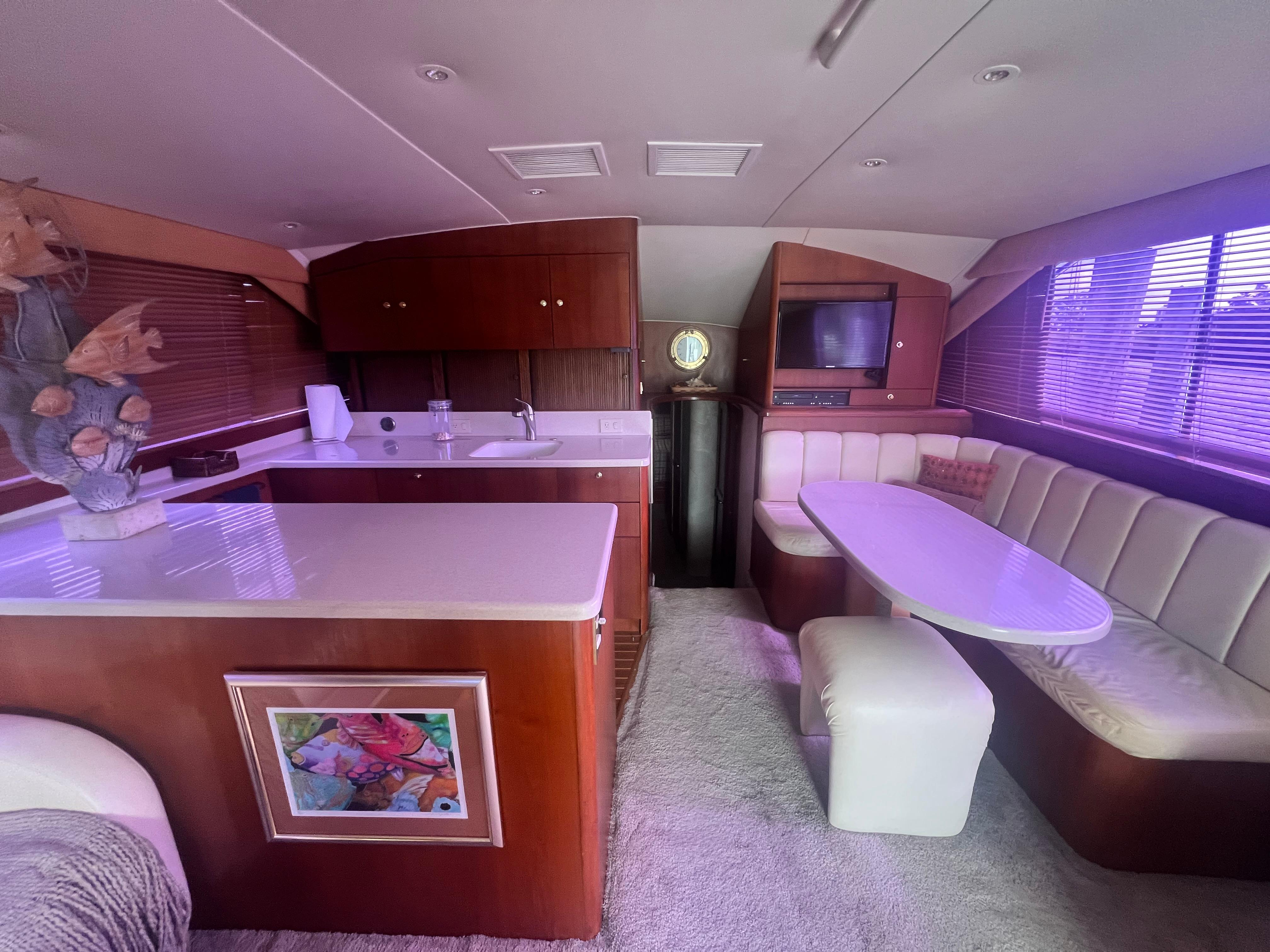 Ocean Yachts-48 Super Sport 1996-Fender Bender FL-US-Interior of 1996 Ocean Yachts 48 Super Sport with kitchen and dining area.-9657986 | Thumbnail