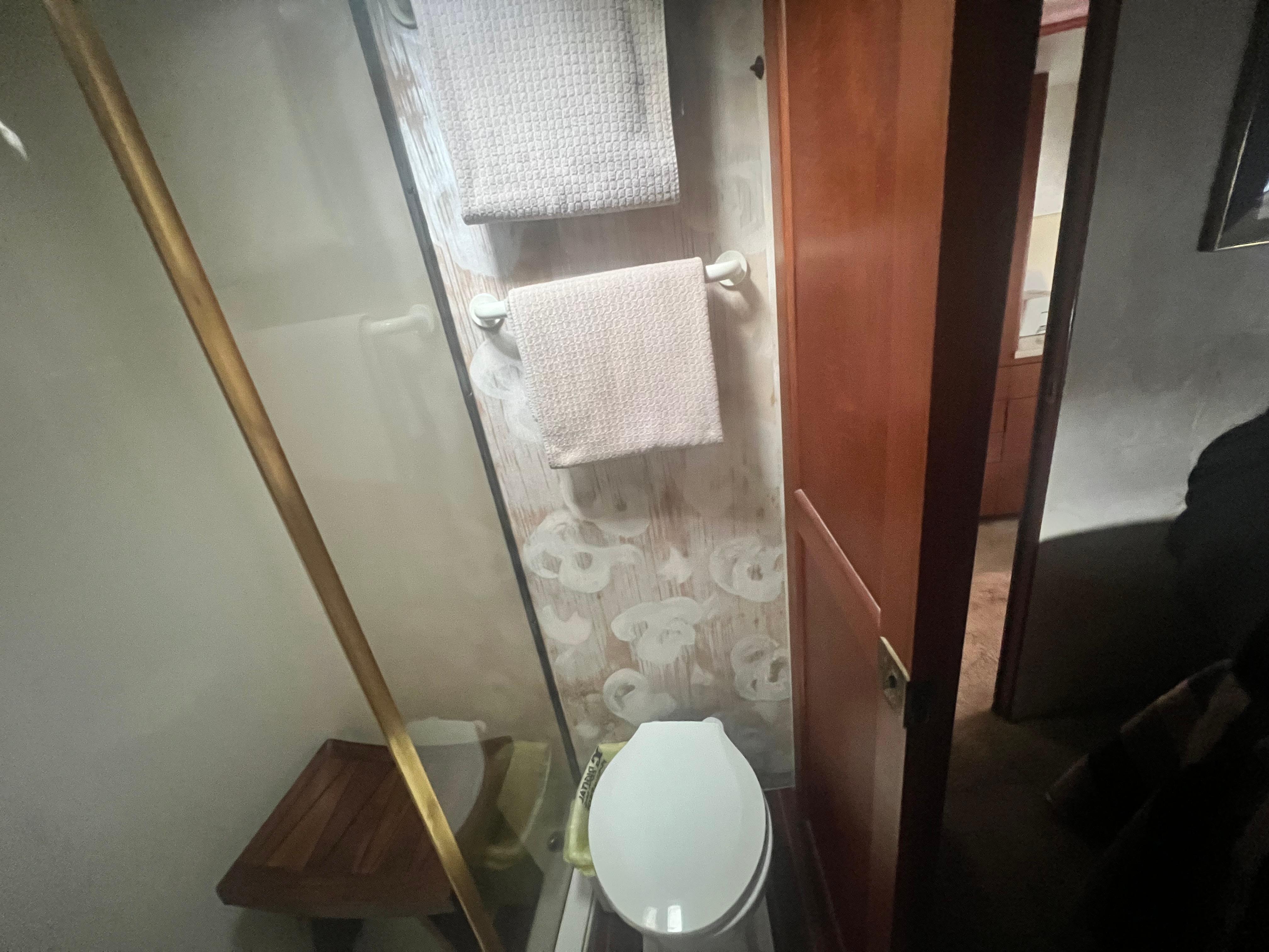 Ocean Yachts-48 Super Sport 1996-Fender Bender FL-US-Bathroom interior of 1996 Ocean Yachts 48 Super Sport with towels and toilet.-9657986 | Thumbnail