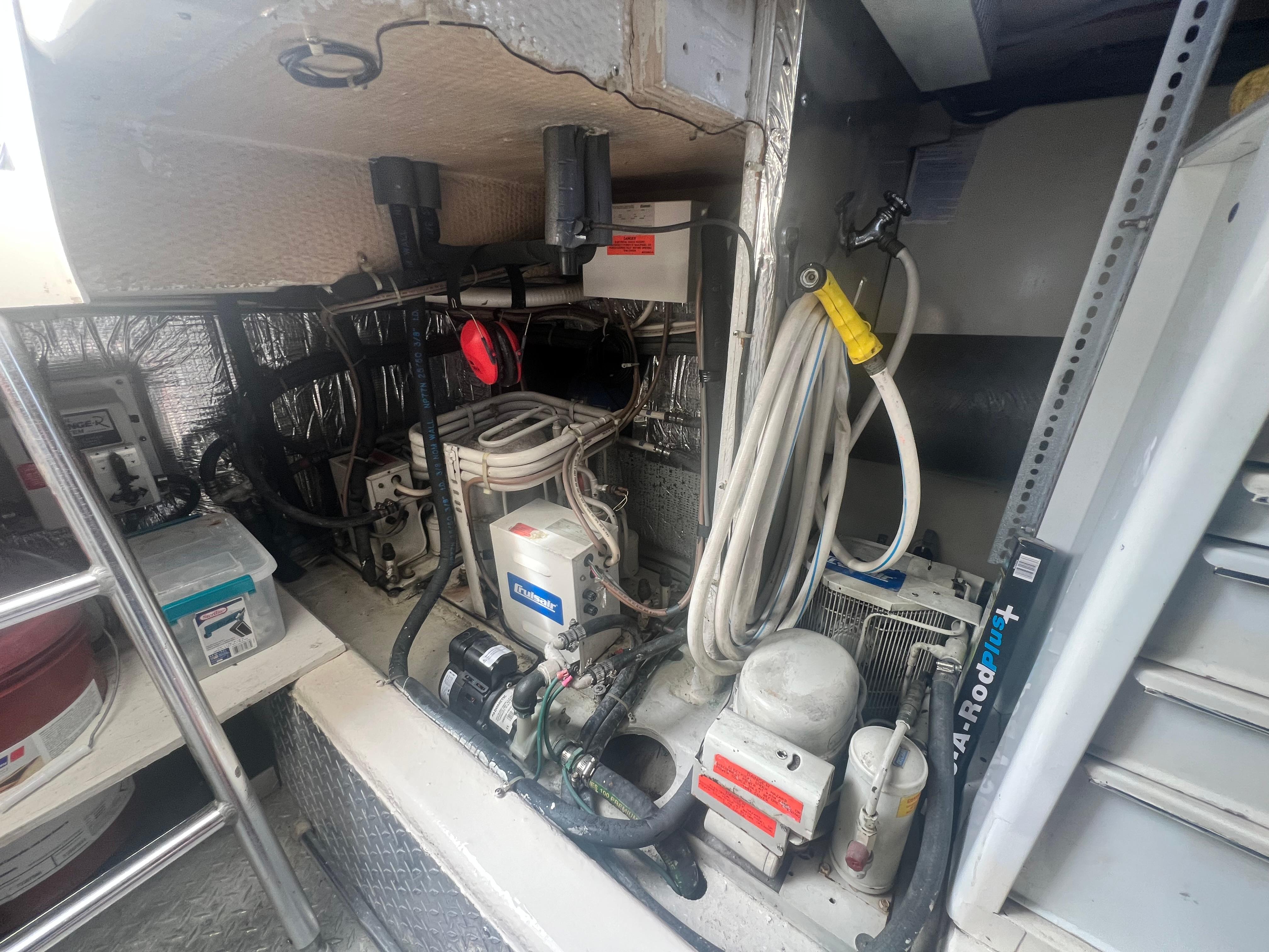 Ocean Yachts-48 Super Sport 1996-Fender Bender FL-US-Engine room of a 1996 Ocean Yachts 48 Super Sport, showcasing mechanical components and wiring.-9657986 | Thumbnail