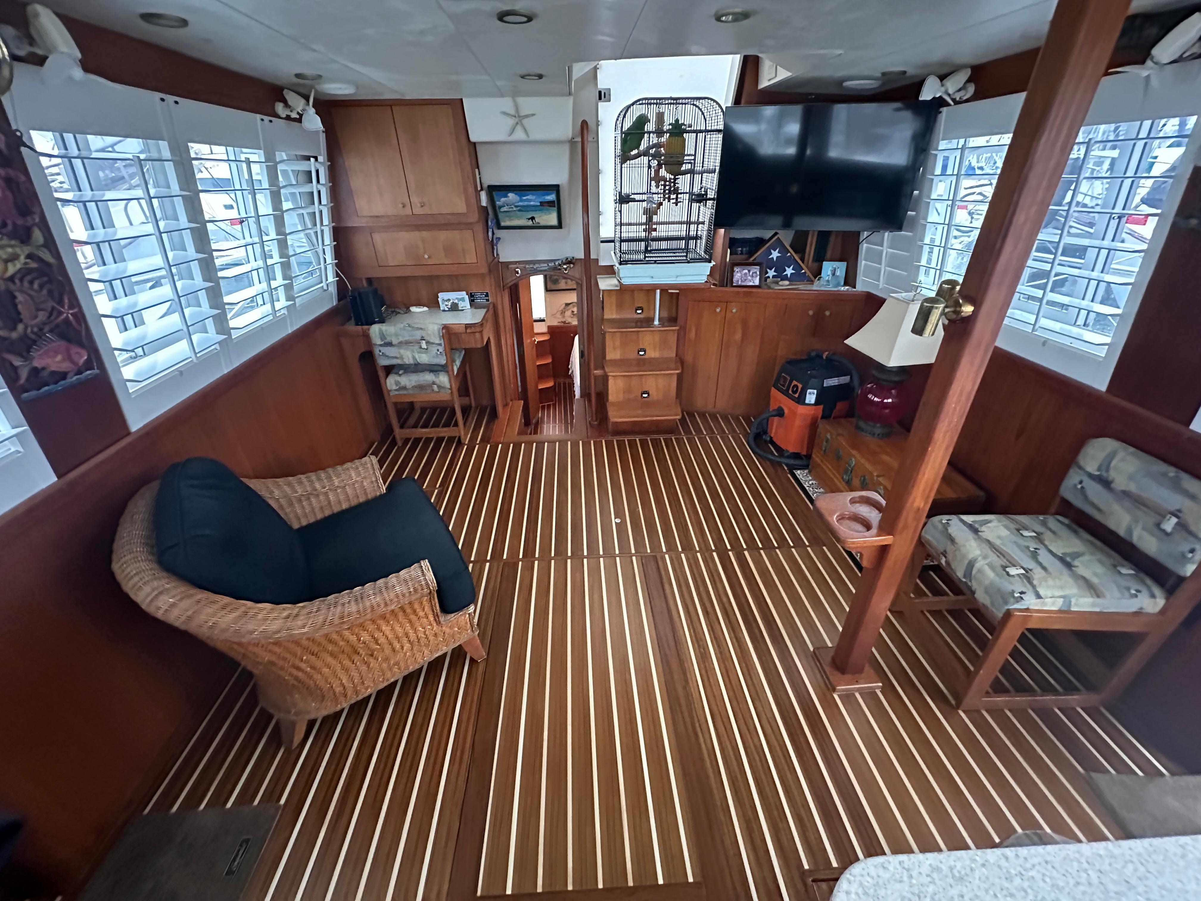 Mainship-430 Trawler 2002-Northstar FL-US-Interior of 2002 Mainship 430 Trawler with wood flooring, seating, and decor.-9620840 | Thumbnail