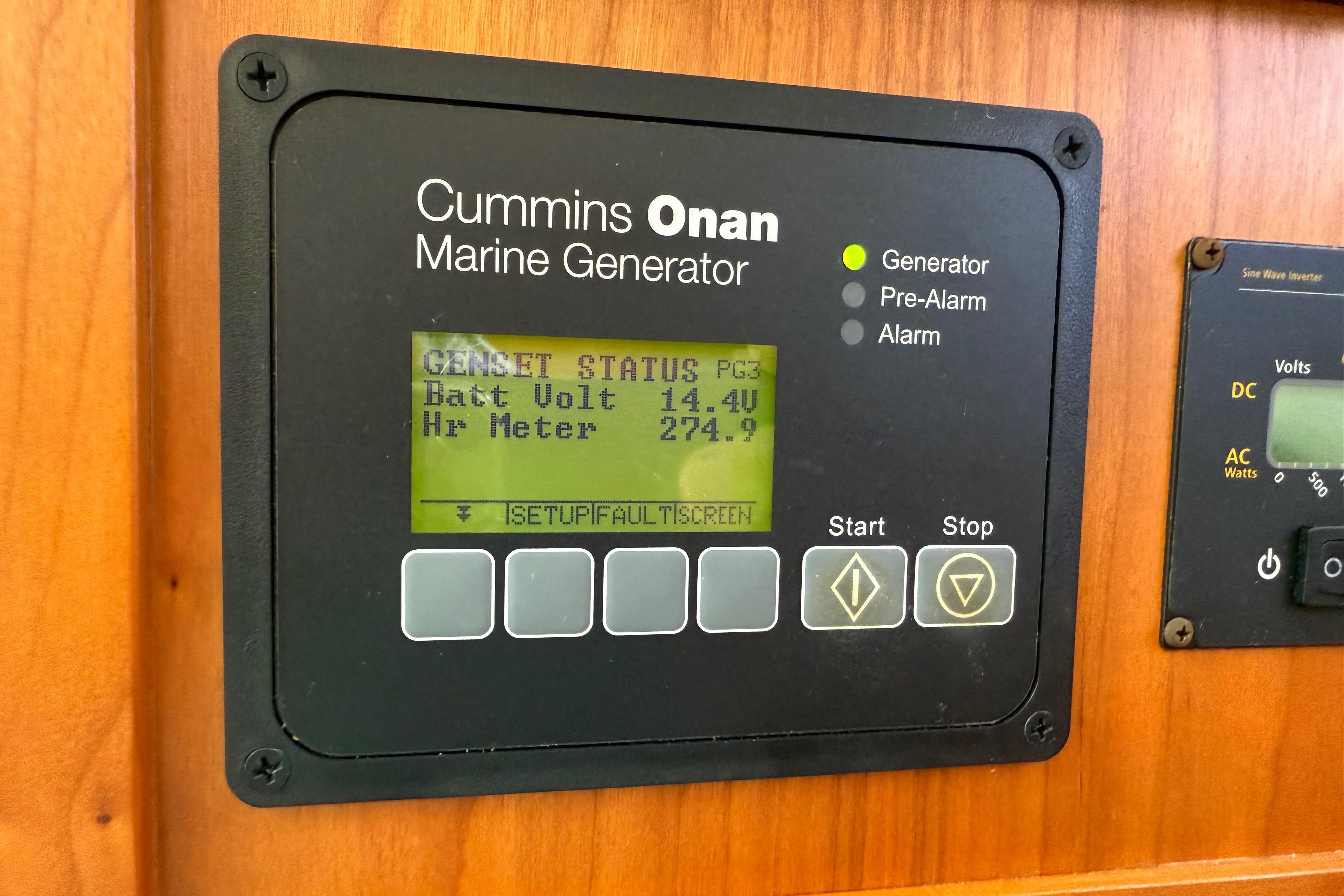 Cummins Onan marine generator display on 2013 Back Cove 34 boat, showing battery voltage and hour meter.