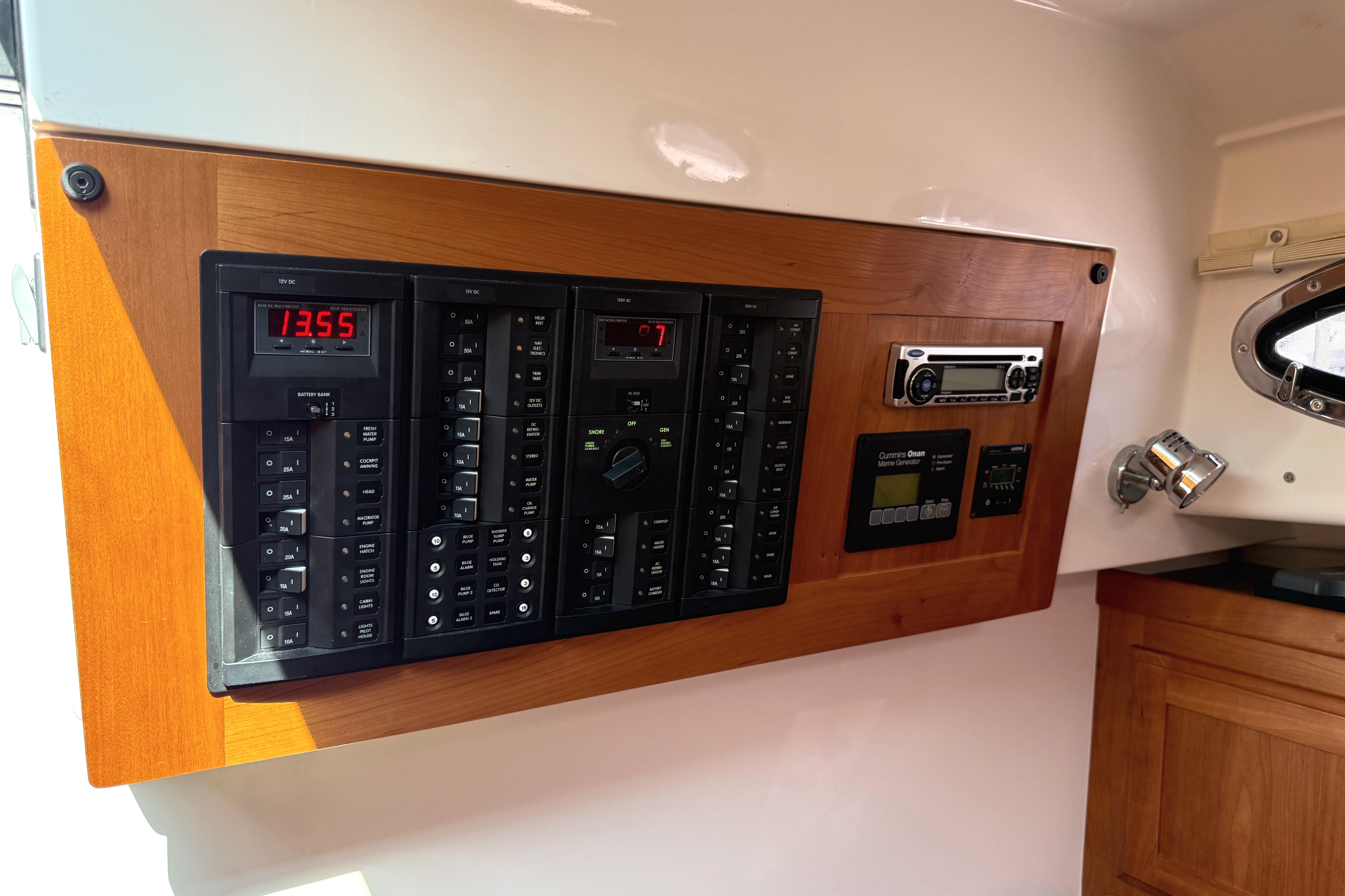 Control panel of a 2013 Back Cove 34 boat with electronic displays and switches.