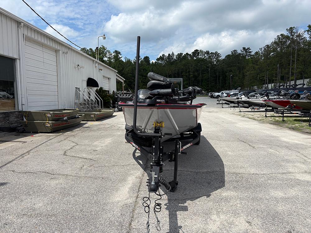 2024 Tracker Pro Team 190 TX boat on trailer, parked outside dealership.