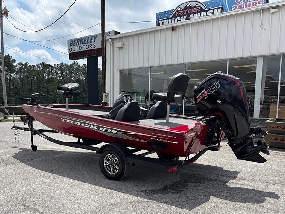 2024 Tracker Pro Team 190 TX boat in red, parked outside Berkeley Outdoors.