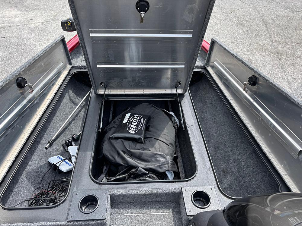 2024 Tracker Pro Team 190 TX boat storage compartments with open lids and equipment inside.