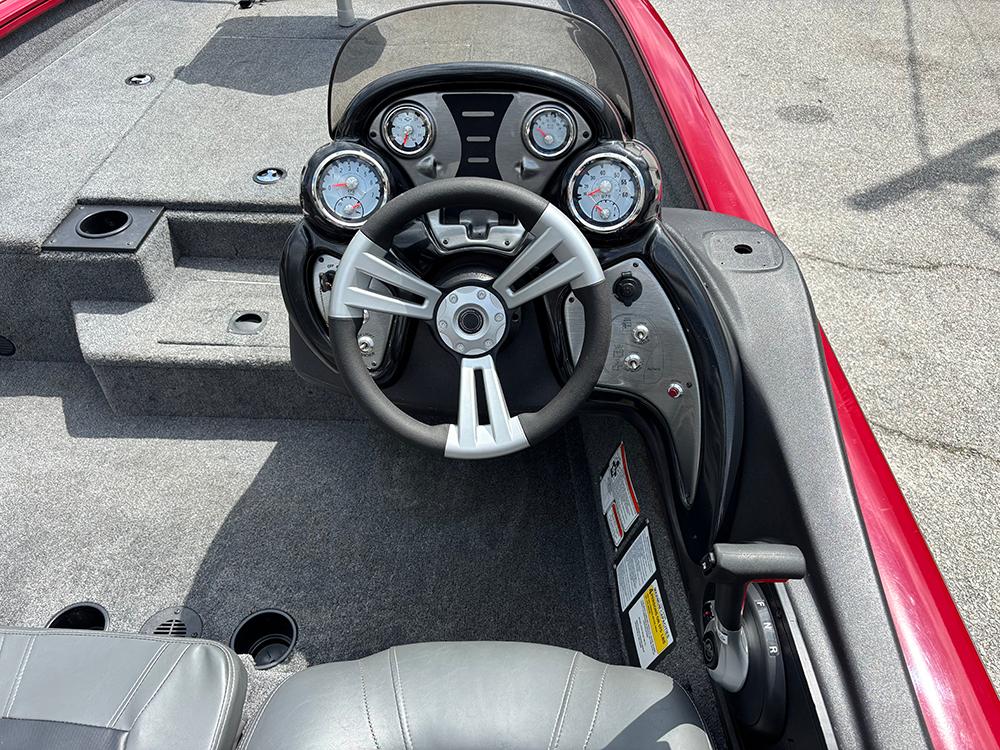 2024 Tracker Pro Team 190 TX boat cockpit with steering wheel and instrument panel.