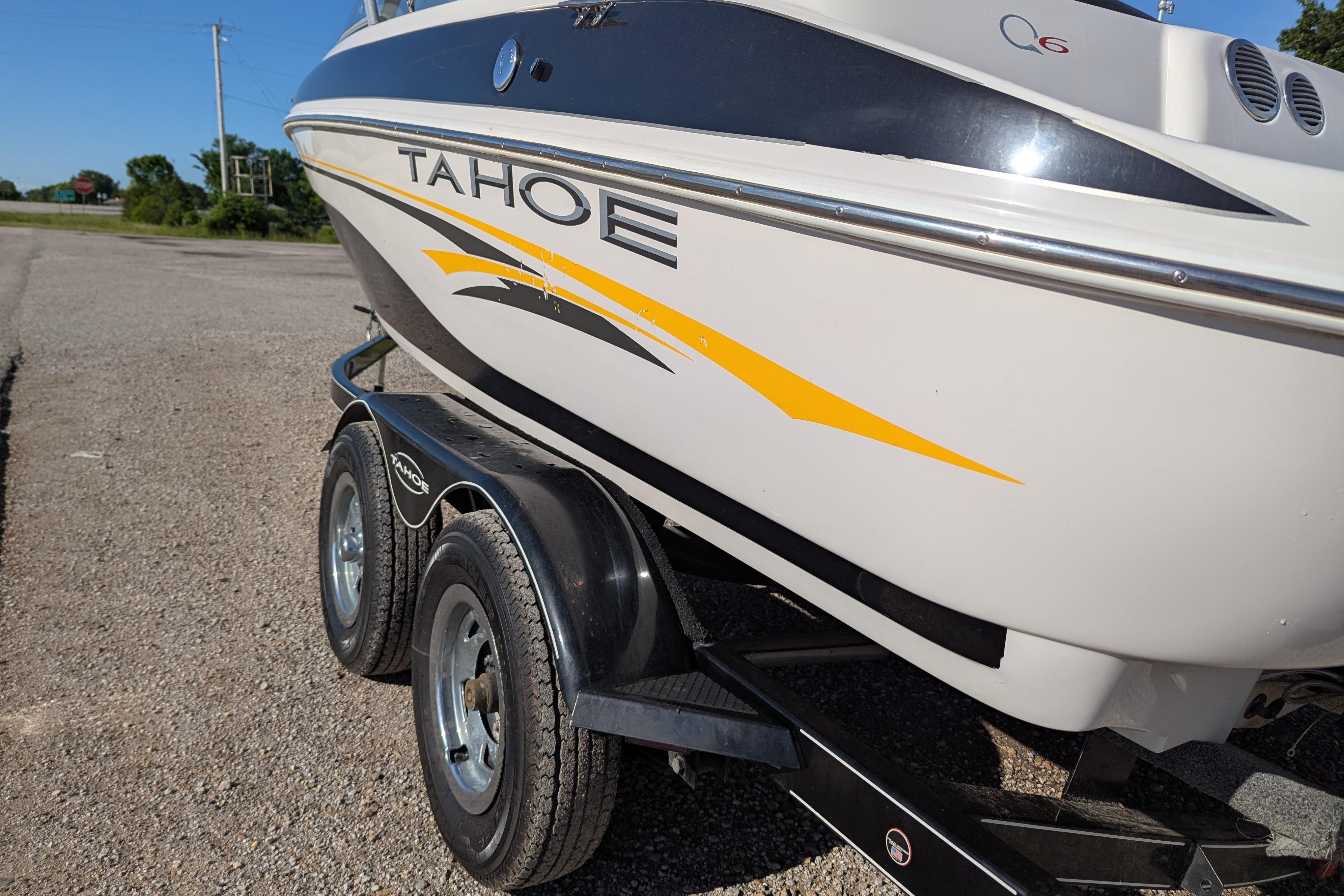 2006 Tahoe Q6 Sport boat on trailer, featuring sleek design and vibrant yellow accents.